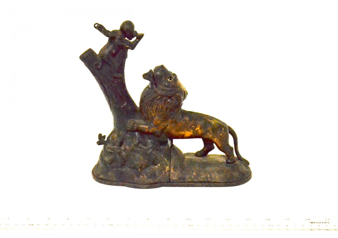 Antique Lion Bank: Victorian cast iron bank with monkey in a tree and lion in pursuit. Missing bucket in boy's hand.