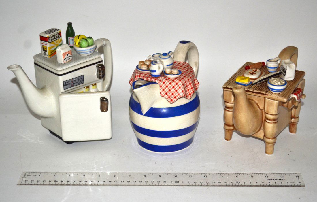 Three Whimsical Teapots: A refrigerator, table and tablecloth form teapots. All by Southwest, England. Small teapot applique needs to be glued.