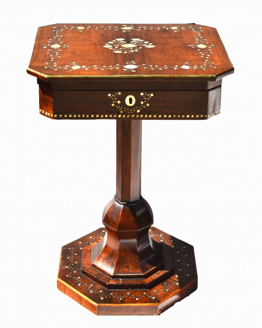 Victorian English Sewing Stand: Octagonal rosewood and mother-of-pearl sewing stand. Hinged top with a fitted interior mirror on the inside top. [19 1/2" x 17 3/4" x 36 1/2" H].