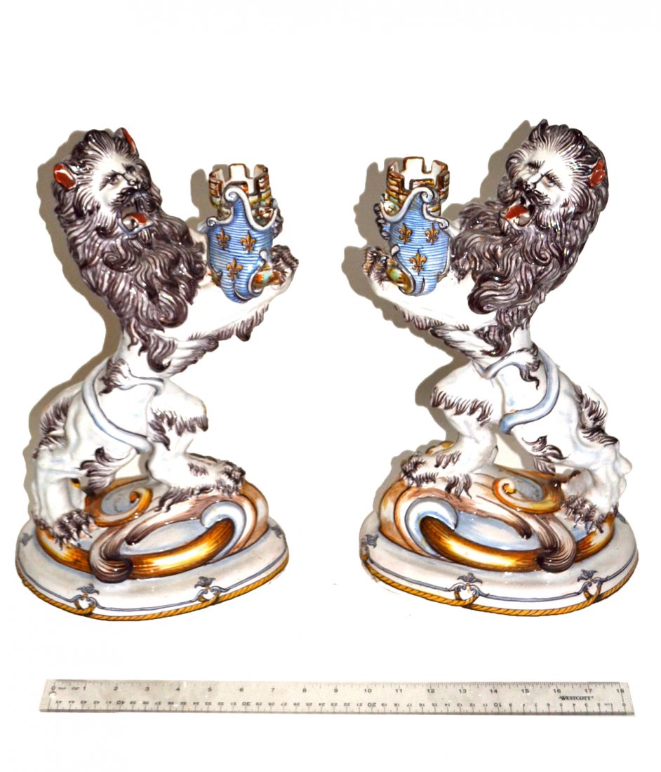 Pair of Galle Lions: Pair of Faience lions with armorial shields, inscribed Galle, Nancy, S.L. Clement. [17" H].