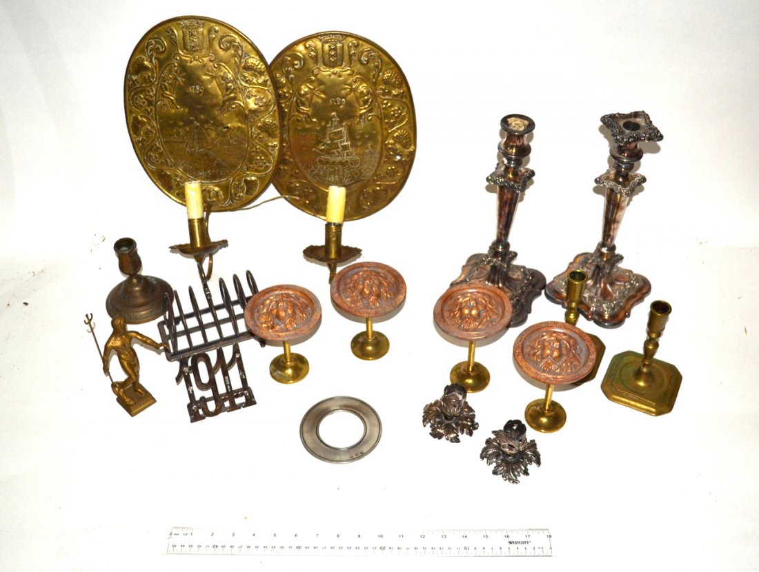 Group of Brass & Silverplate (12-15pcs.): Pair of brass relief sconces, candlesticks, four lion appliques and others. 12-15 pieces.