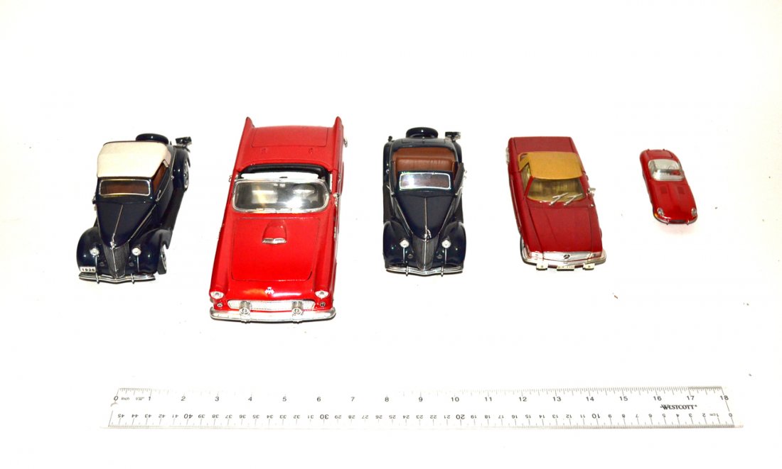 Five Model Cars: Two similar Danbury mint Fords, red Mercedes (Italy), red Jaguar (Denmark), and a red Thunderbird (road tough).