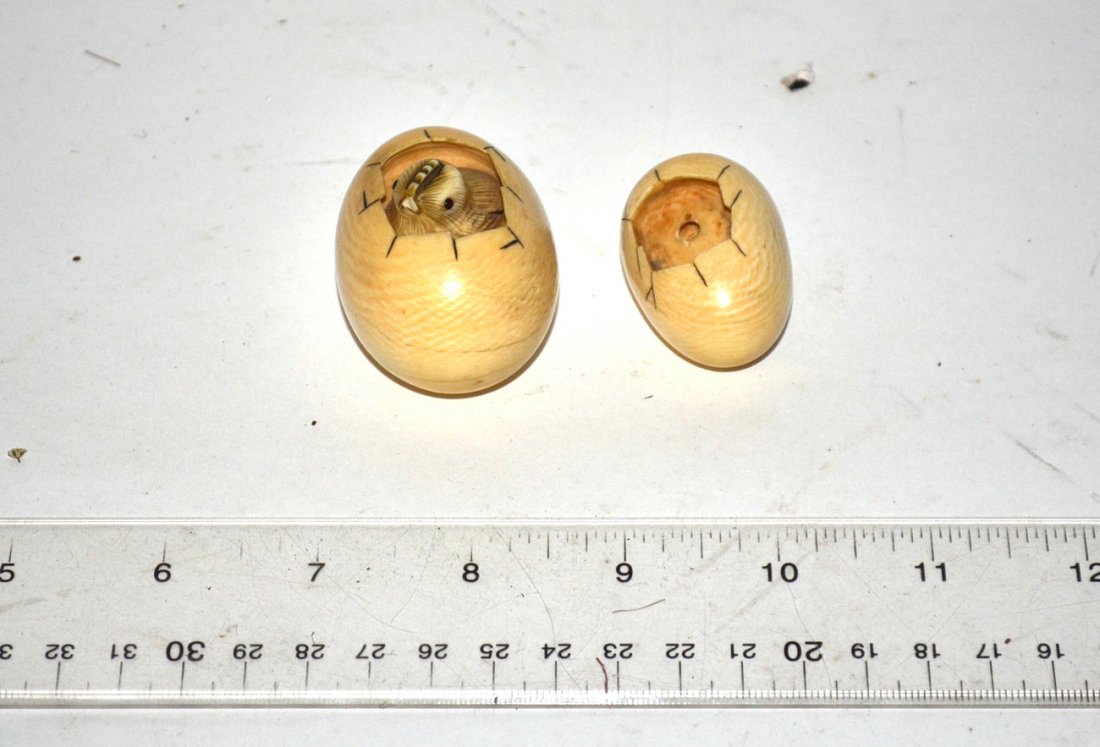 Two 19th Century Netsukes: Each in egg form, one with a chick. Both signed in red and black. Biggest [1 3/4"].
