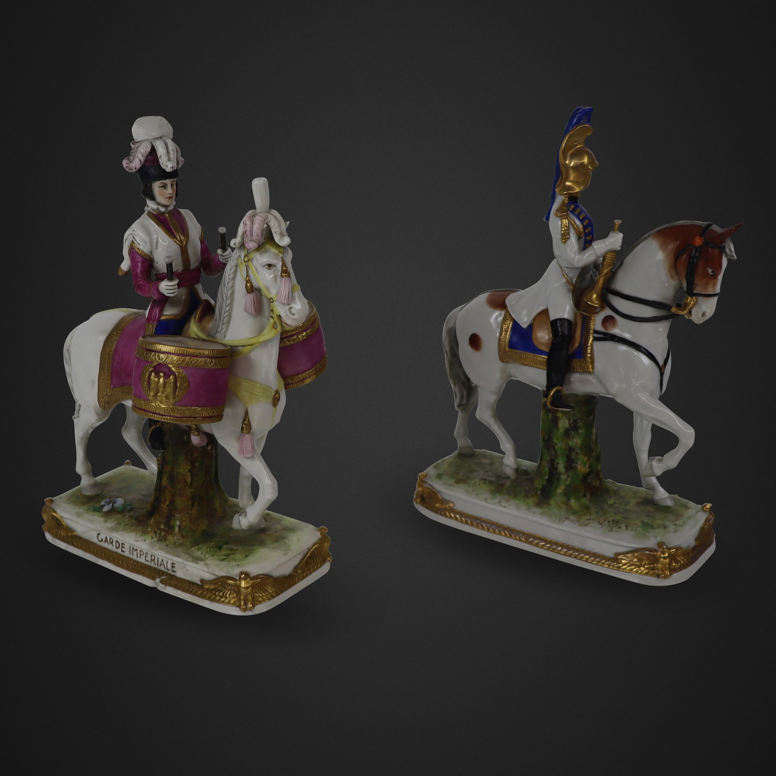 Scheibe-Alsbach, Garde Imperiale, Two Figures: Scheibe-Alsbach, two Garde Imperiale figures, circa mid-20th century, after the French Military, including one with drums and the other with a horn, each marked to bases. [11.5" H x 8" W x 3.5" D]. Co