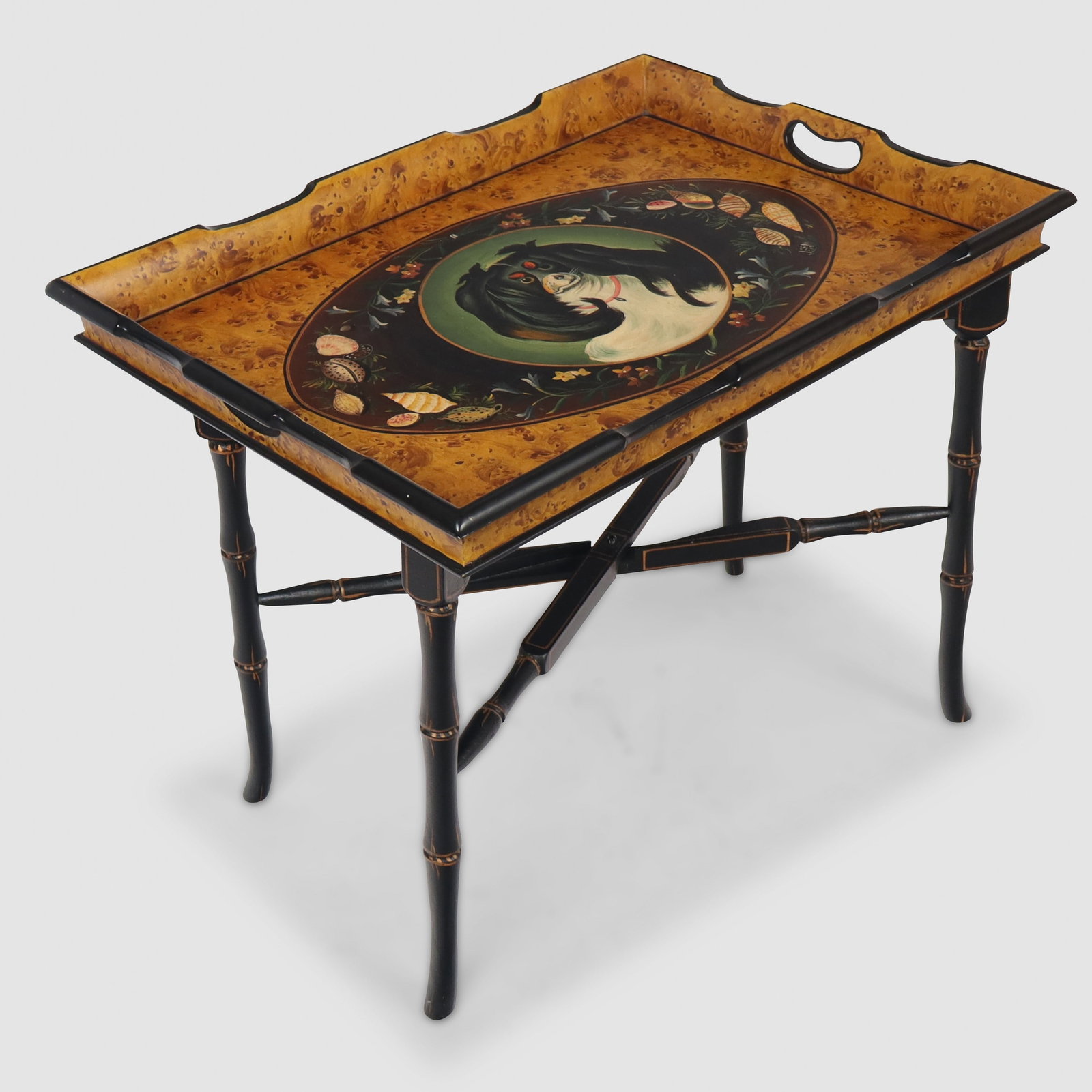 Regency Style Tray Top Table with Dog: Regency style tray-top table, 21st century, with hand painted dog medallion with seashell details and hand-painted faux burlwood ground, over a detached turned and black painted base. [21.5" H x 27"