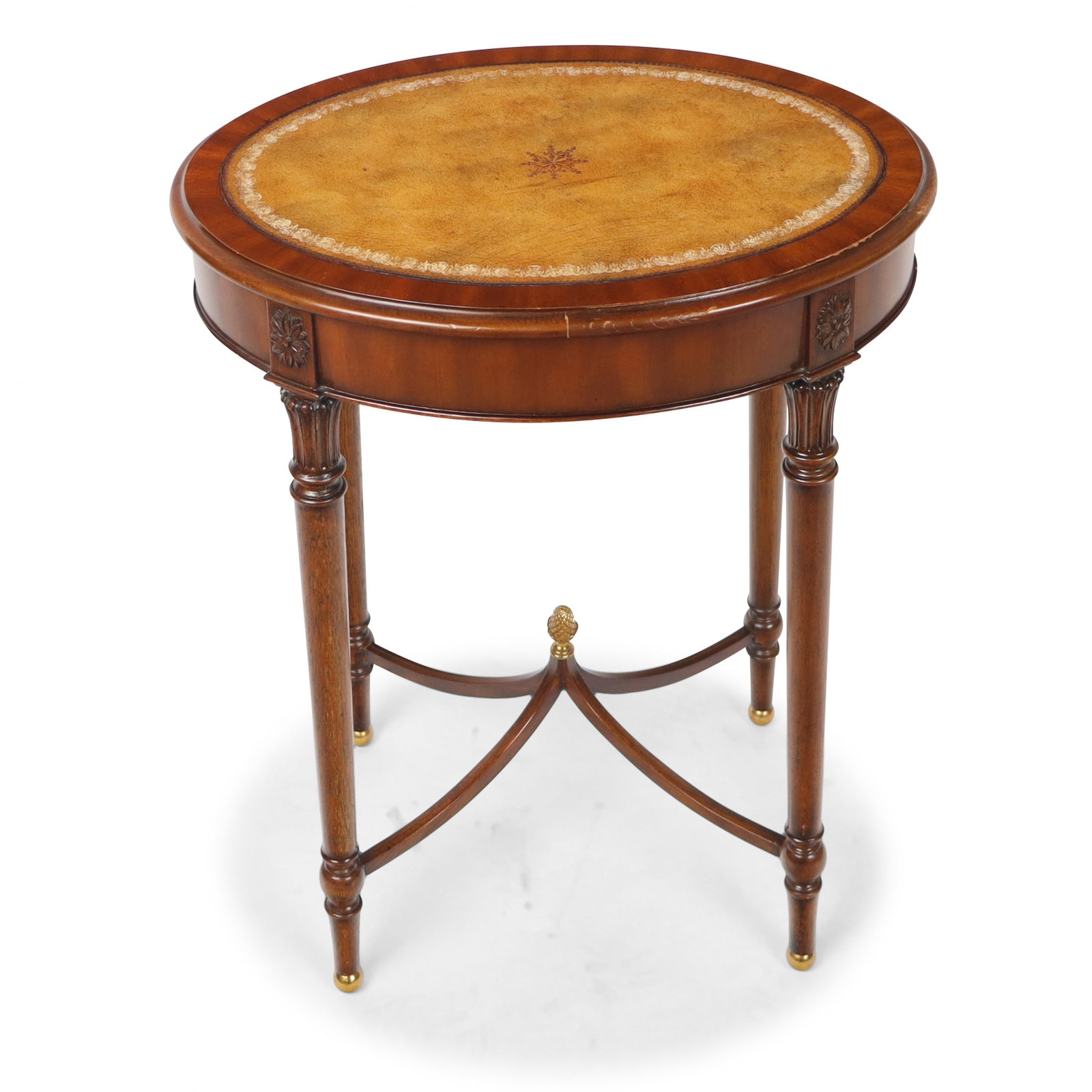 Maitland Smith Leather Top Side Table: Maitland Smith leather top side table, 21st century, with tooled leather to upper, and four carved and tapered legs joined by a cross stretcher and terminating in brass ball feet, marked Maitland