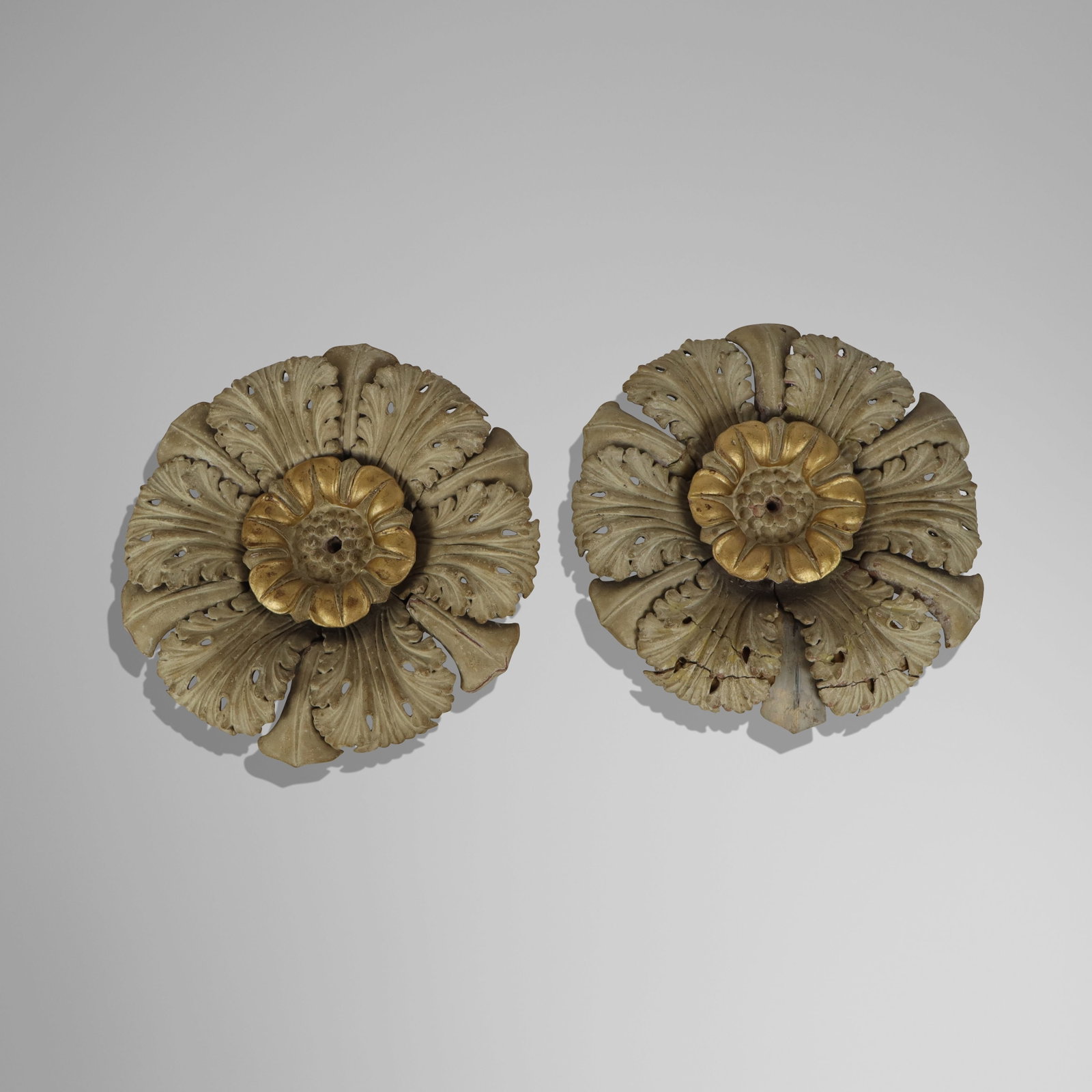 Pair of Antique Resin Rosette Architectural Fragme: Pair of antique gilded and gessoed resin acanthus leaf rosette architectural fragments. [14" Diameter]. Overall condition is fair, one heavily repaired and damaged.