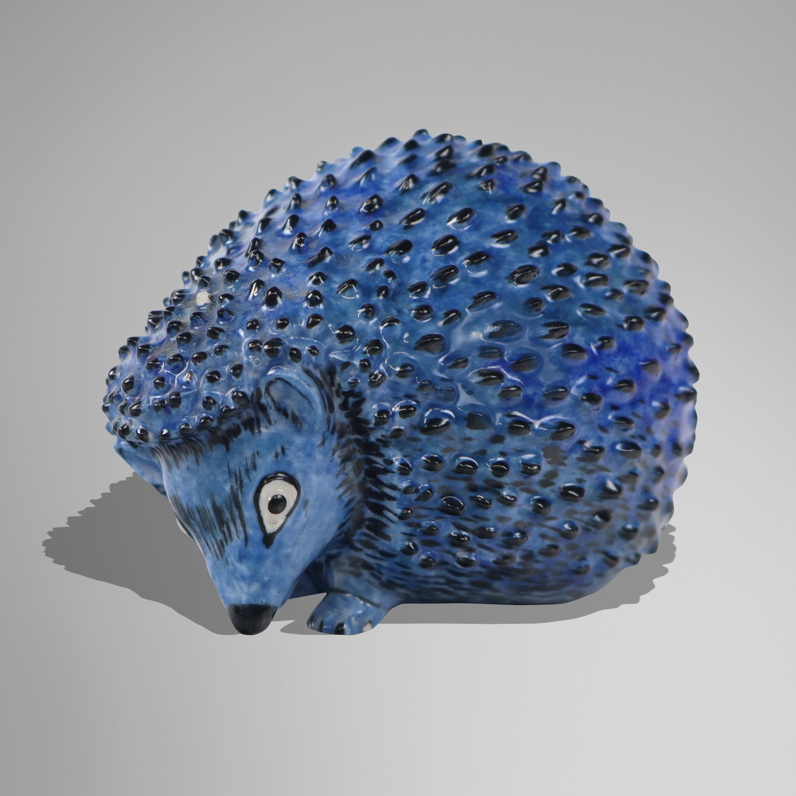 Nymphenburg Porcelain Hedgehog: Nymphenburg porcelain figure of a hedgehog, 1910-1975 mark to base, designed by Luise Terletzki-Scherf, circa mid-20th century, marked to base with LTS to side. [3" H x 4" W x 2.75" D]. Condition is g
