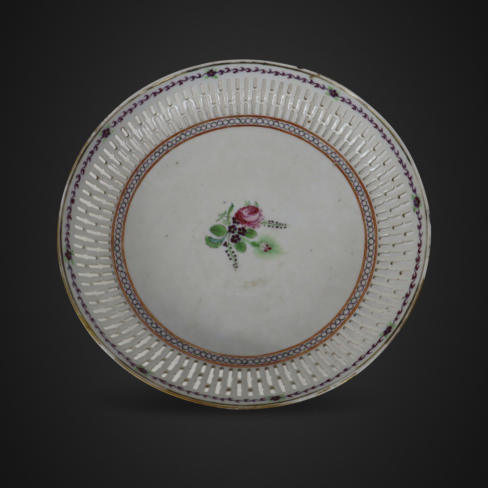Chinese Export Reticulated Porcelain Plate: Chinese export reticulated porcelain plate, Qing Dynasty, early 19th century, with hand painted floral decoration to center, and further decoration to rim, unmarked. [9.5" Diameter]. Condition is
