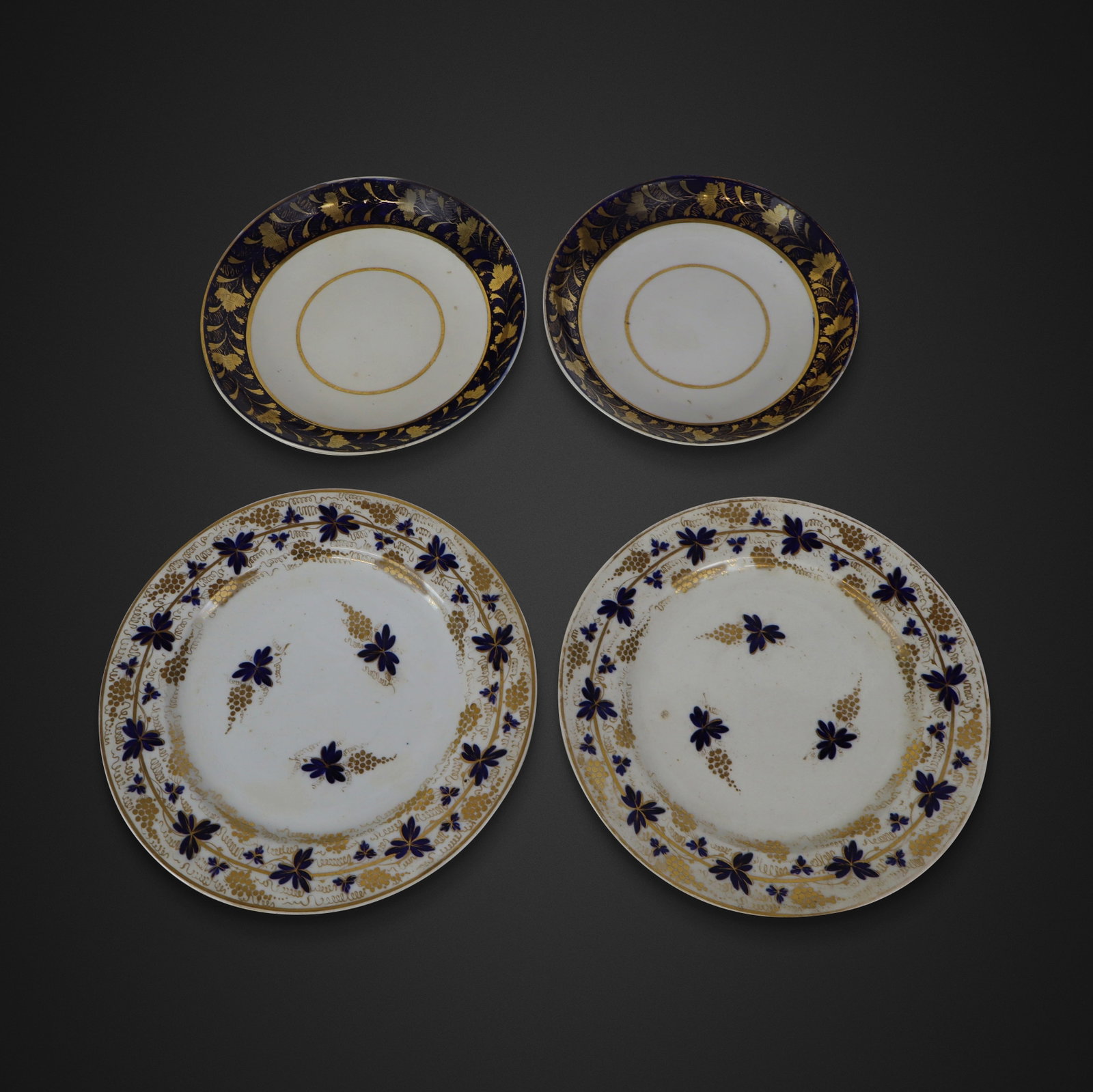 Derby Two Pair of Early Foliate Decorated Plates,: Derby two pair of early cobalt blue and gilt foliate decorated plates, English, circa 1806-1825, marks to base. [8.25" Diameter and 10" Diameter]. Overall condition is good/fair, one white plate with