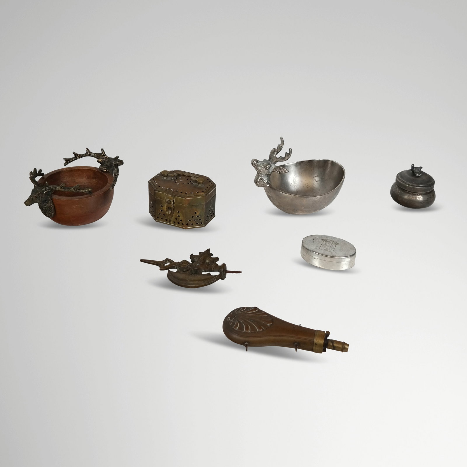 Assorted Venatorial and Other Articles: Assorted venatorial and other decorative articles, 20th century, comprising a brass mounted nut dish with deer, a metal nut dish with deer, a pierced brass box marked Pakistan, a Scottish Piper pewter