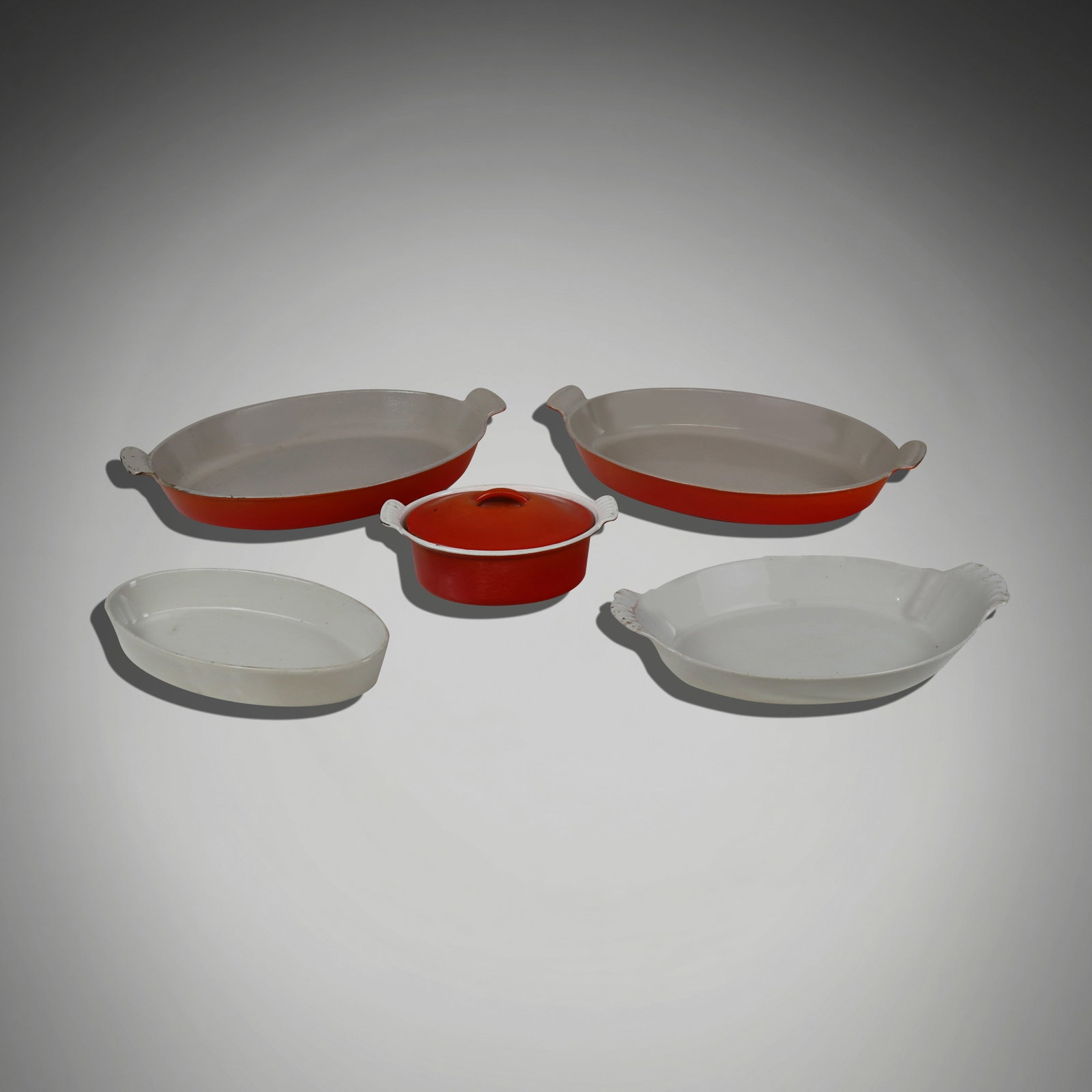 Le Creuset and Pillivuyt Ovenware, 5: Collection of assorted ovenware, comprising a pair of Le Creuset orange enamel oval casserole dishes [16.5" L x 10.5" W], a Le Creuset orange enamel oval covered casserole [8.75 x 5.5" W], together wi