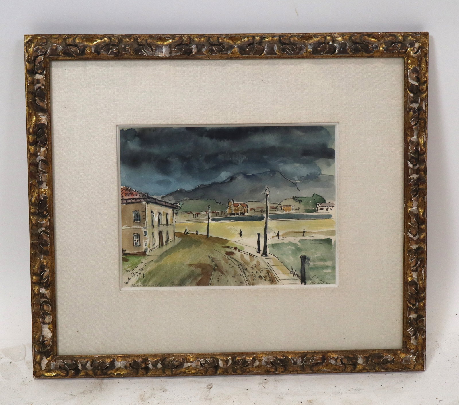Watercolor Coastal Scene of Ribadesella, Spain: Watercolor depicting a coastal landscape with mountains in the distance, "Ribadesella - Spain," pencil signed illegibly lower right and titled lower left, matted and framed. [Sight: 7.5" H x 10.25" W;