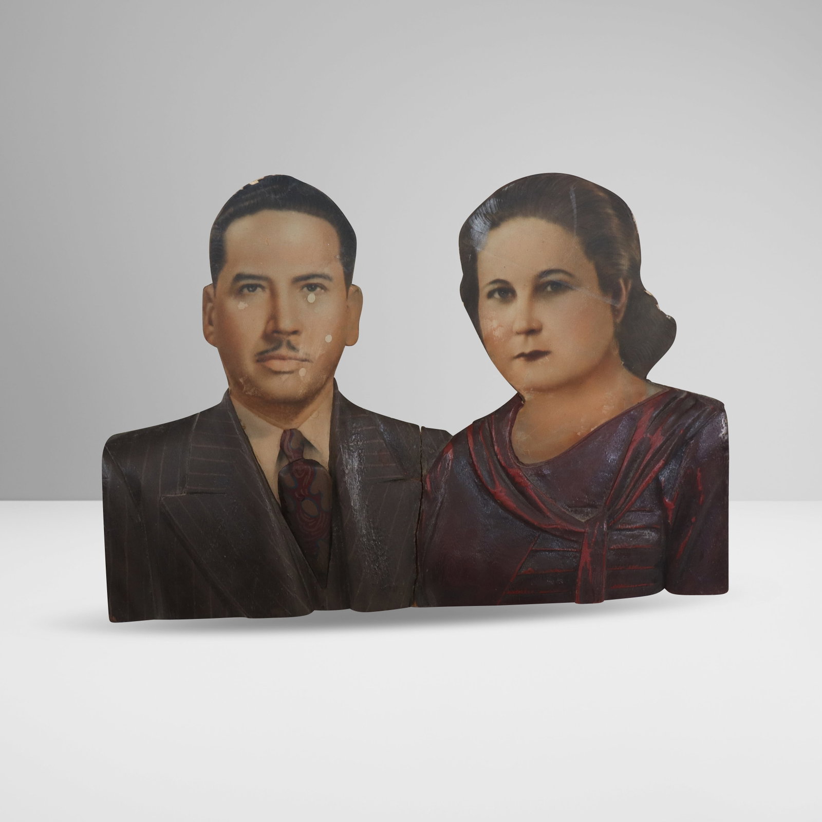 Latin American Carved Wood Wedding Portrait: Latin American carved wood and decoupage double wedding portrait, early to mid-20th century, with hand-painted details. [7" H x 9.75" W]. Condition is good to fair with areas of discoloration and spli