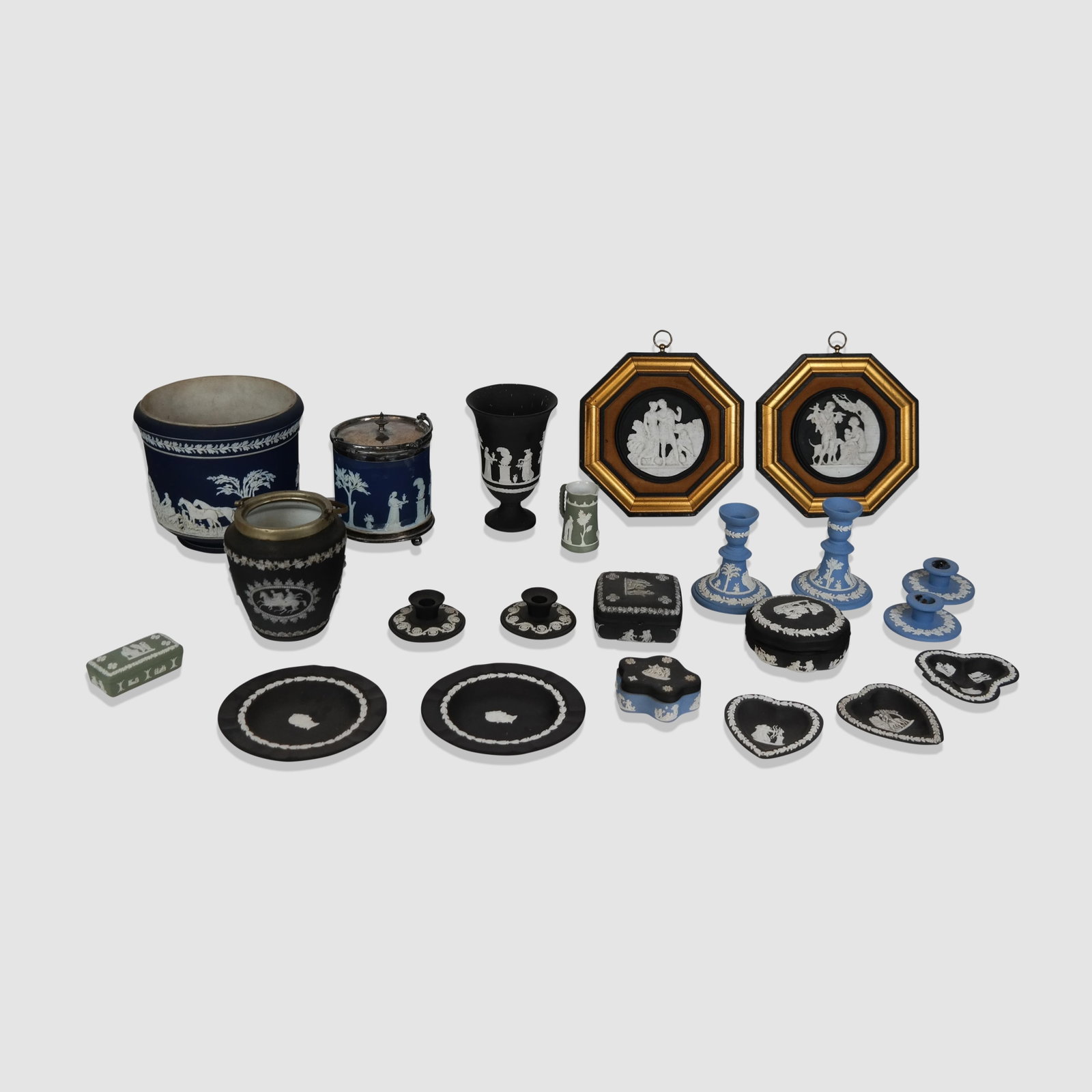 Wedgwood and Other Jasperware, 23: Wedgwood and other jasperware articles, England, 20th century, comprising two black candlestick holders, two blue candlestick holders, a two-tone trinket box, a black trinket box, a black lidded ashtr