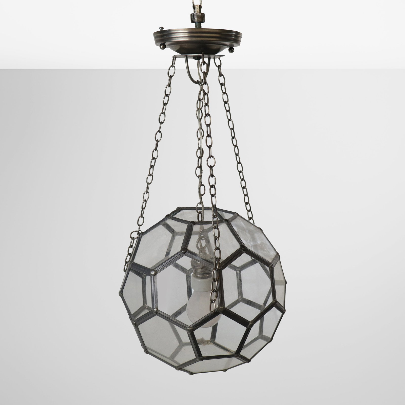 Geodesic Honeycomb Glass and Metal Chandelier: Geodesic or honeycomb metal and glass chandelier, 20th century, with single light to interior. [With mount: 21" H x 12" Diameter]. Condition is good, wiring untested.