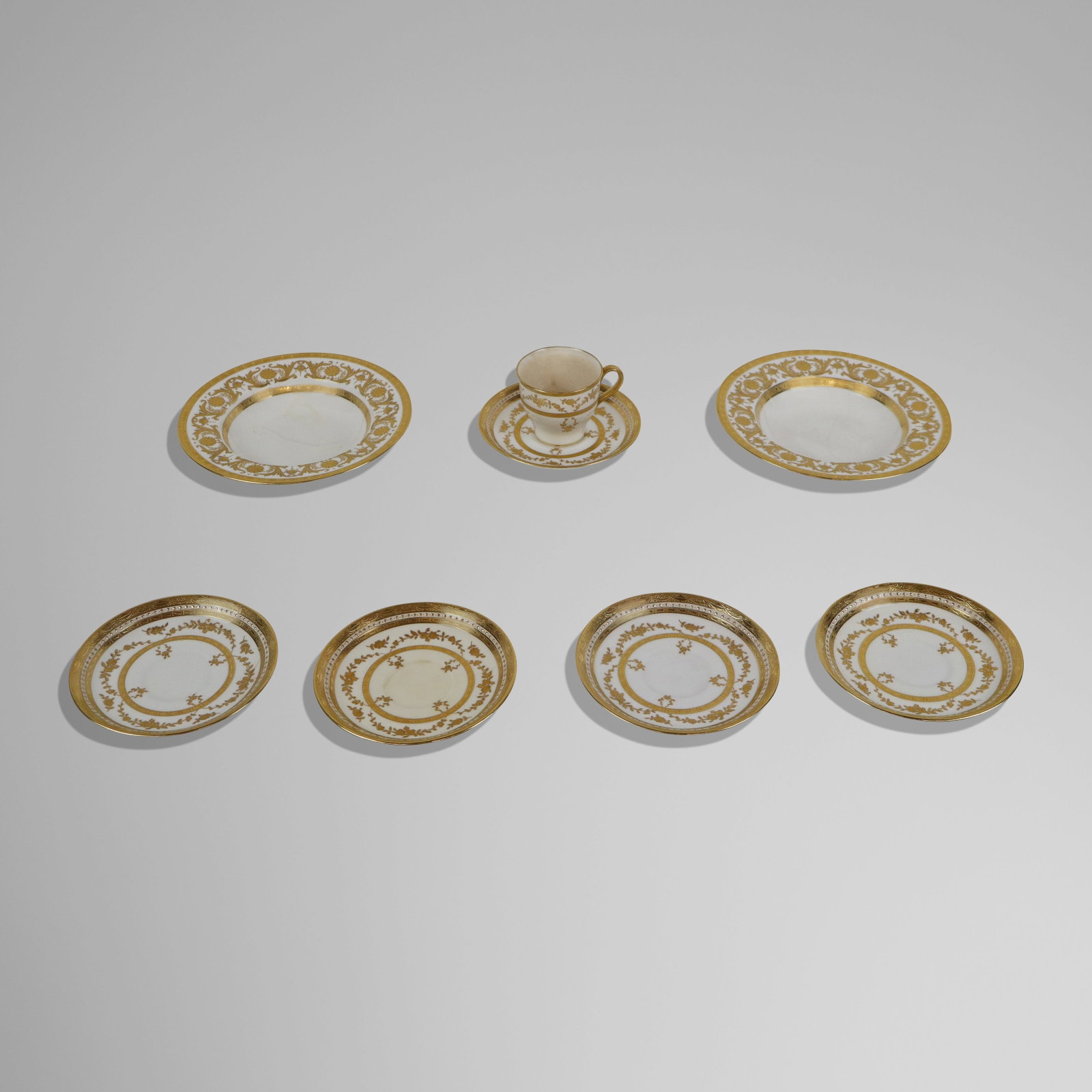 Mintons for Tiffany & Co. Riverton Porcelain, 8: Minton's for Tiffany & Co. Riverton porcelain, England, circa 1920s, comprising a demitasse cup, five saucers, and two fingerbowls. [Fingerbowls: 1.25" H x 6.25" Diameter]. Condition throughout is goo