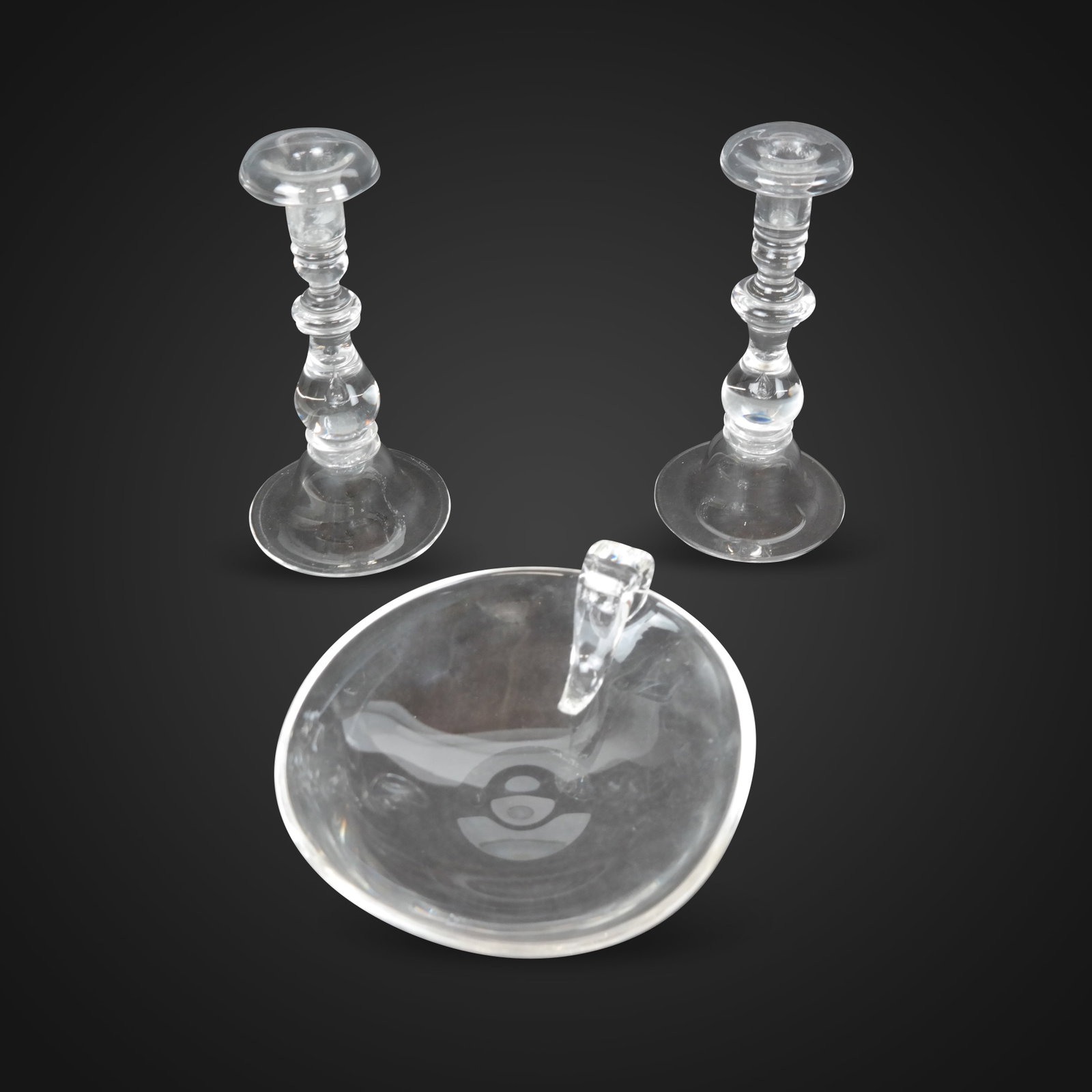 Steuben Glass Candy Dish & Teardrop Candlesticks 3: Steuben pair of "Teardrop" candlesticks [8.75" H x 4.5" Diameter], and a candy dish [3" H x 8.5" W x 8" D], marks to base. Overall condition is good, normal signs of wear, candlesticks with was residu