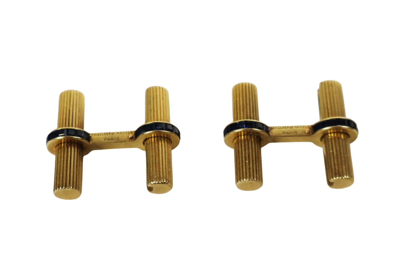 Van Cleef & Arpels Gold & Sapphire Cufflinks, Pair: Van Cleef & Arpels pair of 18K gold and sapphire cufflinks, with French assay mark, signed Van Cleef et Arpels Paris. [Total 8 dwt., 78" x 1 1/8"] Overall condition is good. Property from the family o
