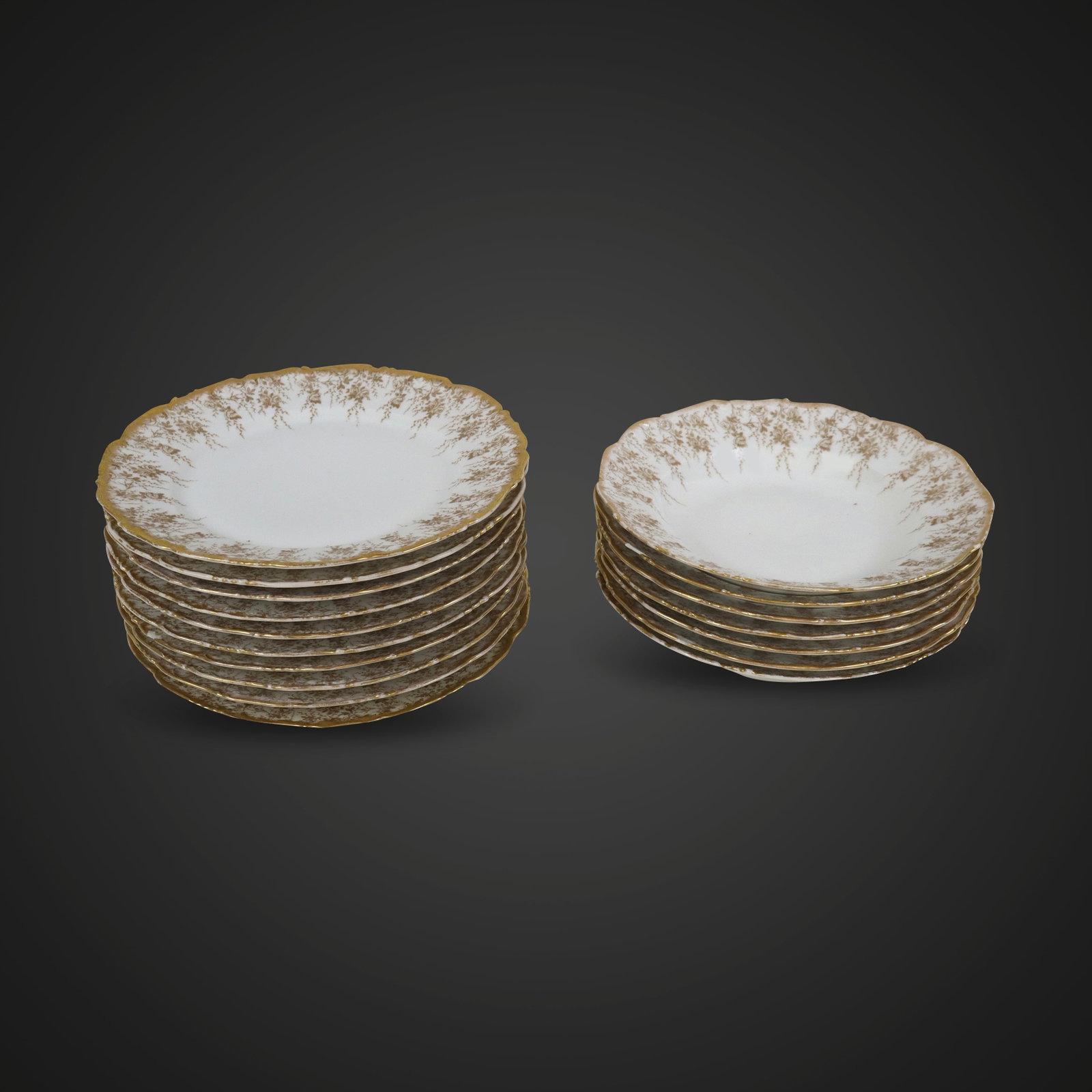 Tressemanes & Vogt Gilt Decorated Plates, 17: Tressemanes & Vogt gilt rose decorated porcelain plates, Limoges, each shaped rim gilded, the borders with rambling roses, comprising seven soup bowls [9" Diameter], and ten dinner plates [9.5" Diamet