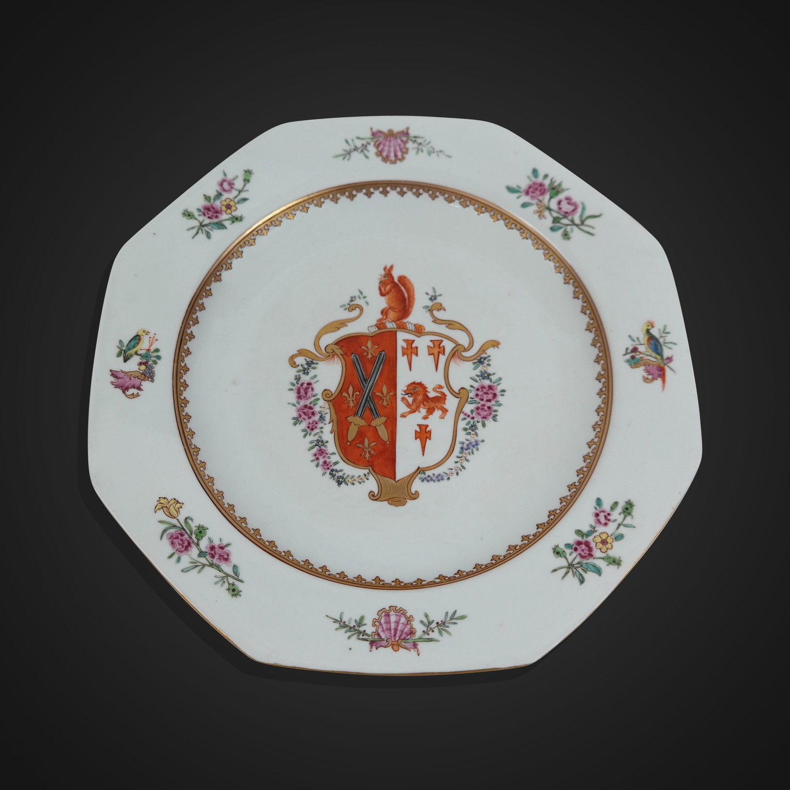 Chinese Export Armorial Plate: Chinese export armorially decorated plate, 18th century, with a coat or arms resembling the Barrow and Dighton families at each side, with hand-painted and floral decoration, marked to base. [9.25" Di