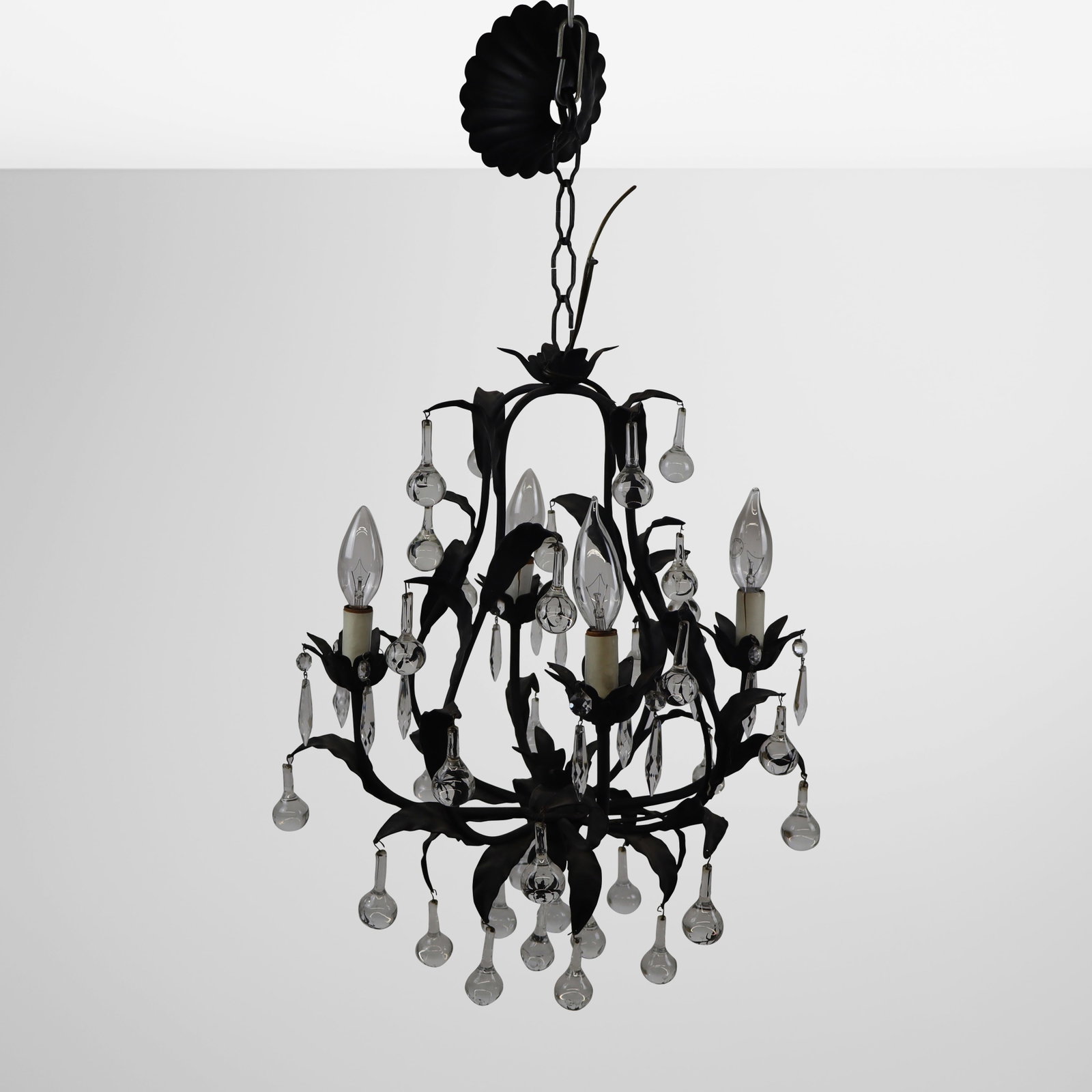 Black Painted Tole Four Light Chandelier: Black painted tole chandelier, 20th century, with four lights and glass and faceted glass bobbles. [Including black painted chain: 27" H x 14" Diameter]. Condition is good; wiring untested.