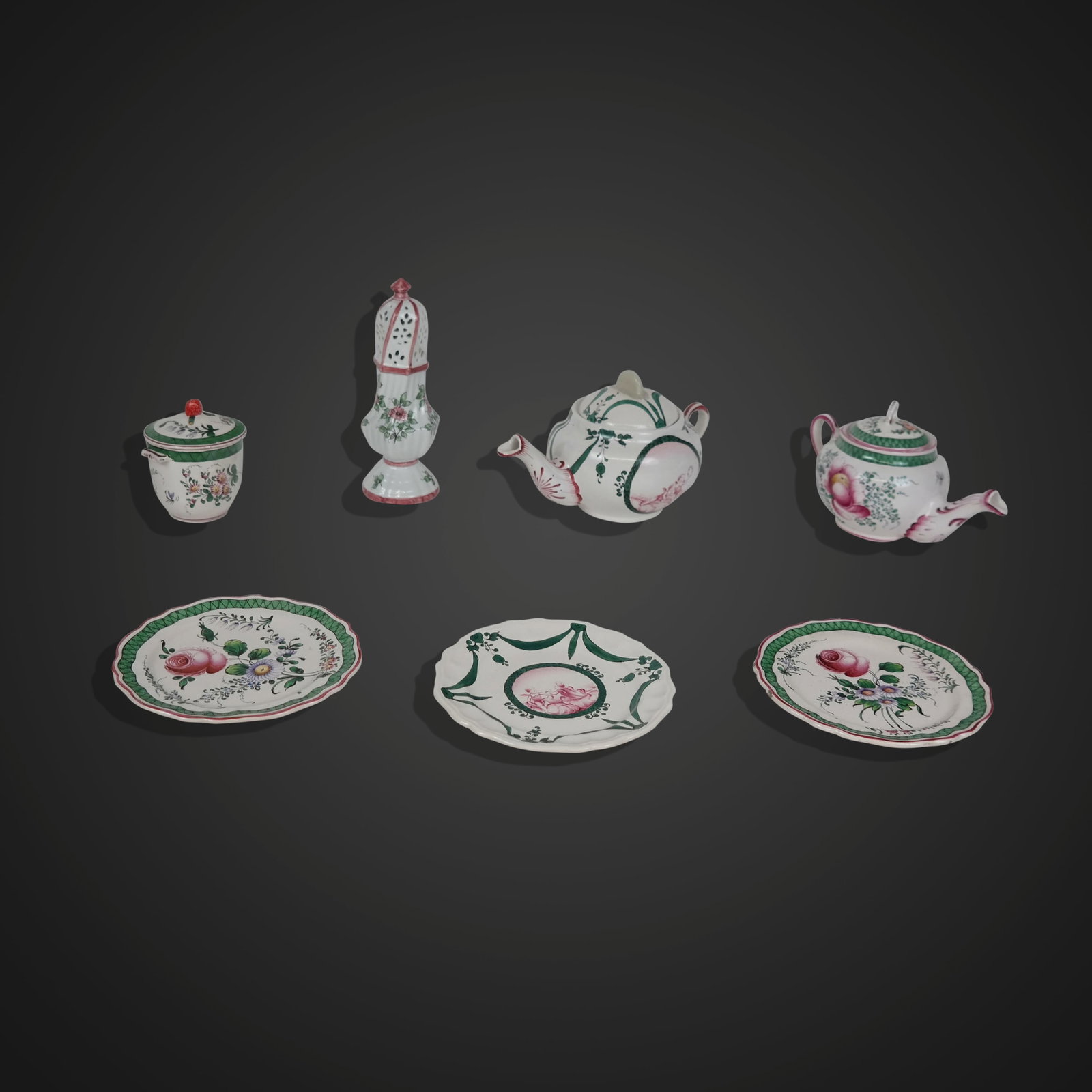 Assorted French Porcelain: Assorted French porcelain items comprising a teapot with underplate, a covered cannister, and teapot with two matching plates, and a master sugar, most marked France to bases. [Larger teapot: 6" H x 9