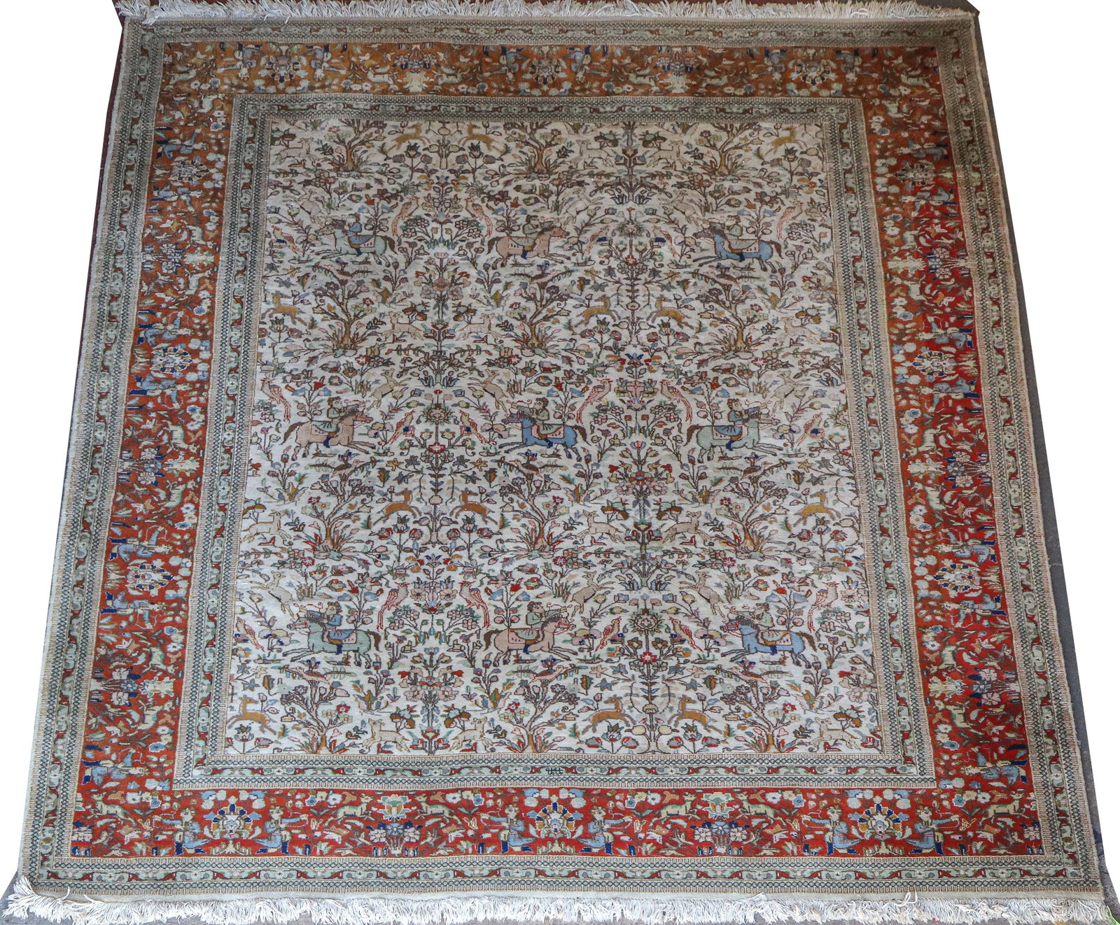 Tabriz Tabatabai Wool Rug: Tabriz wool Tabatabai rug, 20th century, in wool, with elaborate hunting scenes to inner and to border. [Less fringe: 116" W x 142" L]. Condition is good with fading to colors.