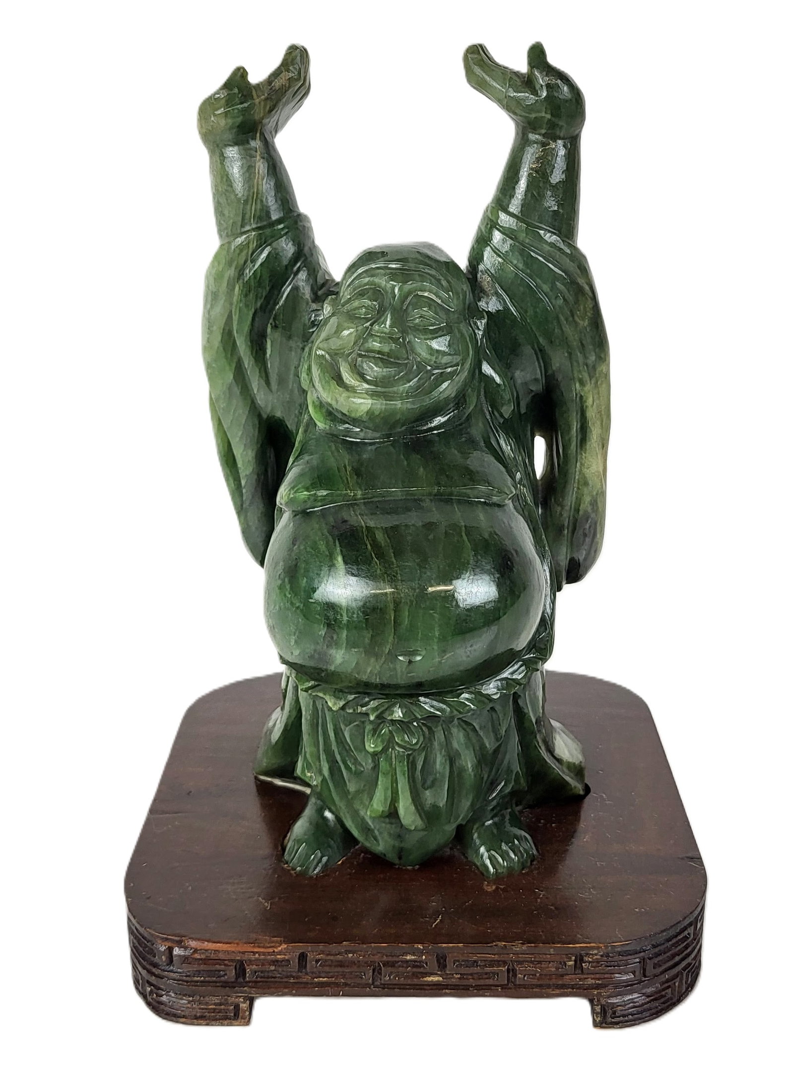 Carved Greenstone Statue of a Laughing Buddha: Carved greenstone figure of a laughing Buddha, 20th century, on an affixed wood base. [Including base: 10" H x 6" Square]. Condition is good.