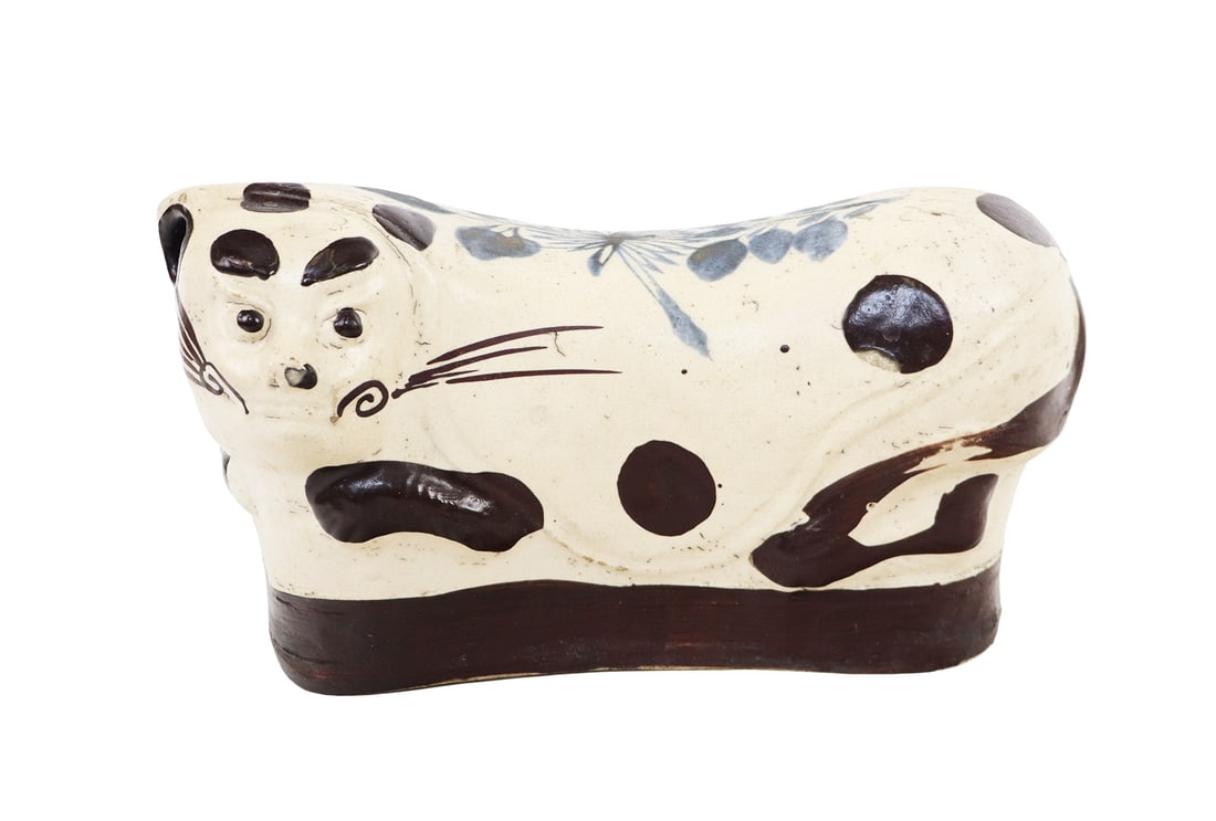 Chinese Qing Cizhou Ware Porcelain Cat Pillow: Chinese cizhou ware porcelain pillow, Qing Dynasty, 19th century, in the form of a cat with hand-painted details. [6.25" H x 11" W x 5" D]. Condition is good with some minor wear and surface cracks.