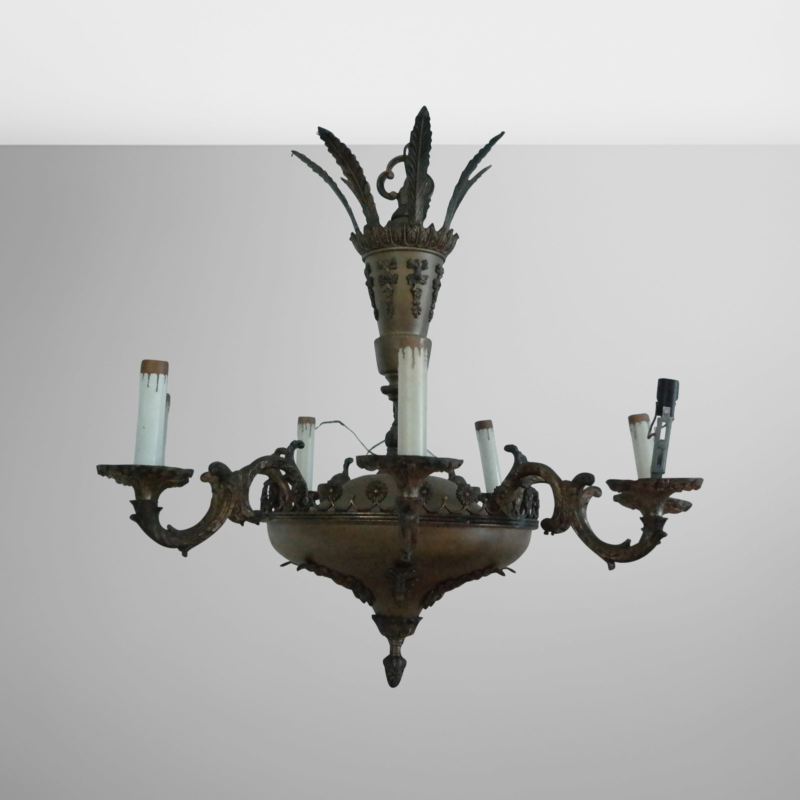 Gilt Metal Chandelier: Gilt metal 7 arm chandelier with wide bowl having floral gallery and 7 scroll arms, fronds mounted post and ceiling chain. 22" H x 24" diameter. Needs cleaning, electric not tested.