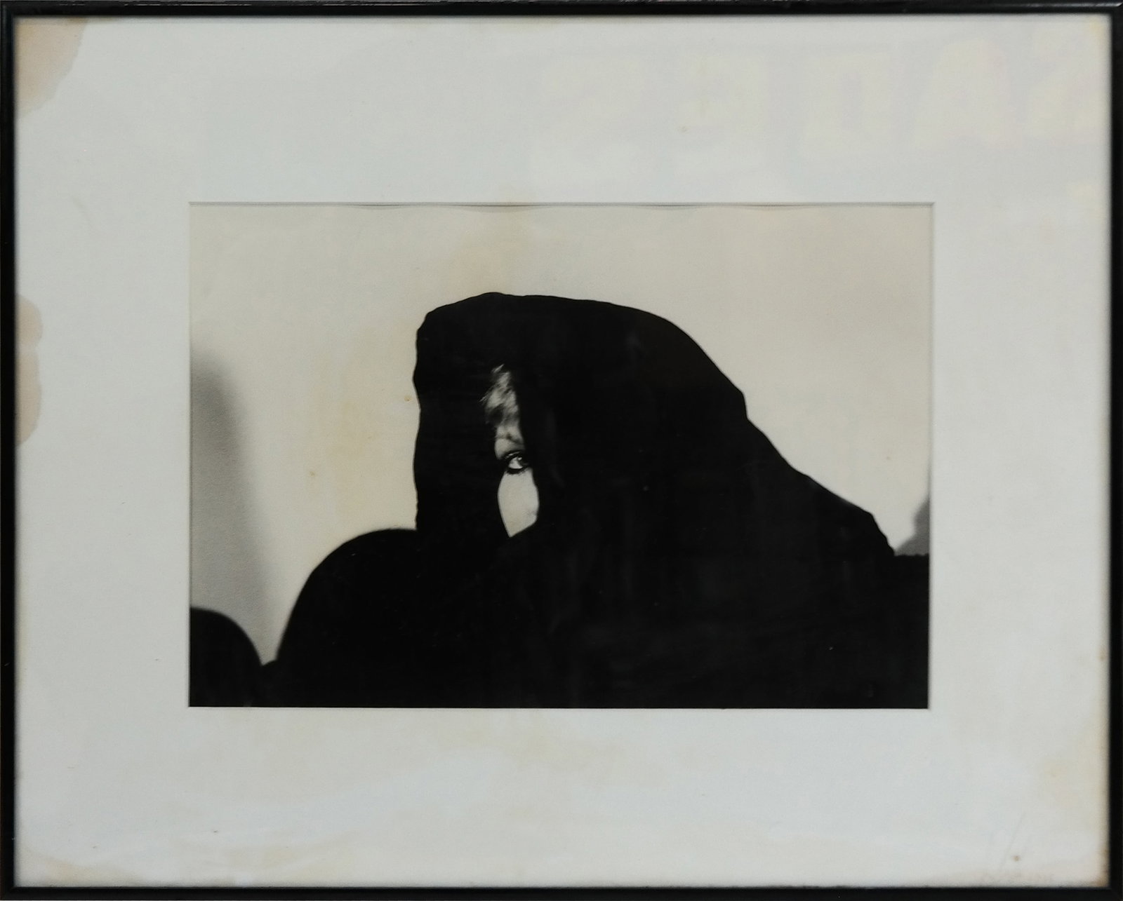 Scott CUNNINGHAM - "Reflections": Scott CUNNINGHAM (Amer. 20th Century). "Reflections" Black and White Photograph depicting a woman behind a black veil. Signed on matting, dated 1988. [9" x 13"; 16" x 20"]. Water damage to matting.