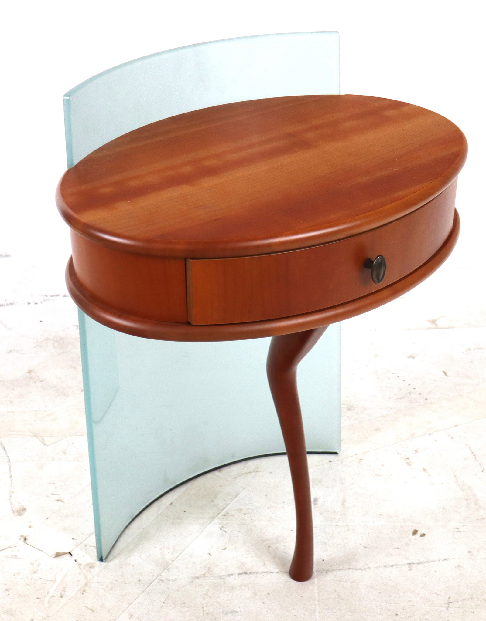 Modern Wood and Glass Side Table: Modern side table, 21st century, with a single drawer, and frosted glass support to verso, and a single leg to front, unmarked. [27" H x 20" W x 15" D]. Condition is good.