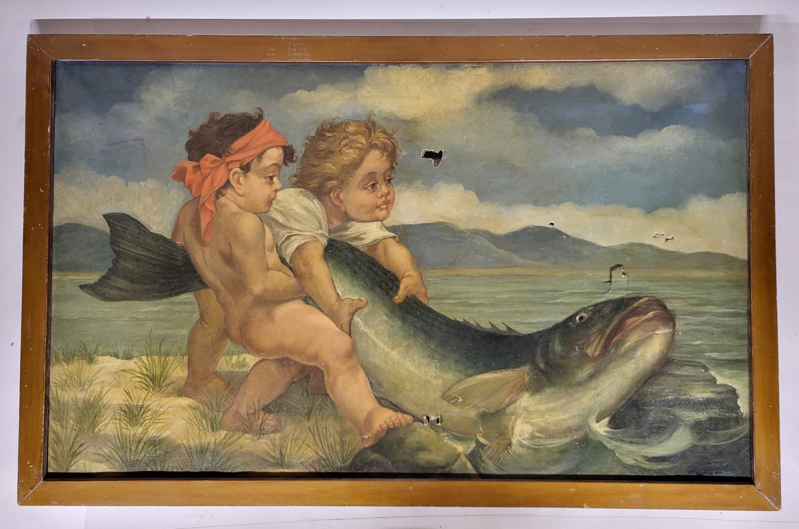 Children with a Fish Figural Oil on Canvas: Figural oil on canvas, early 20th century, depicting two children with a fish, unsigned, in a frame. [Framed: 24.5" H x 38.5" W]. Condition is fair with holes, a tear, and an area of repair to work. F