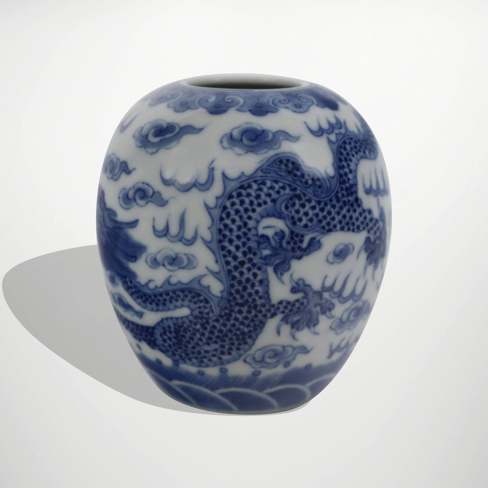 Chinese Blue and White Diminutive Jar: Chinese diminutive jar, 20th century, with hand-applied blue and white and phoenix decoration, marked to base. [3.5" H x 4" Diameter]. Condition is good.