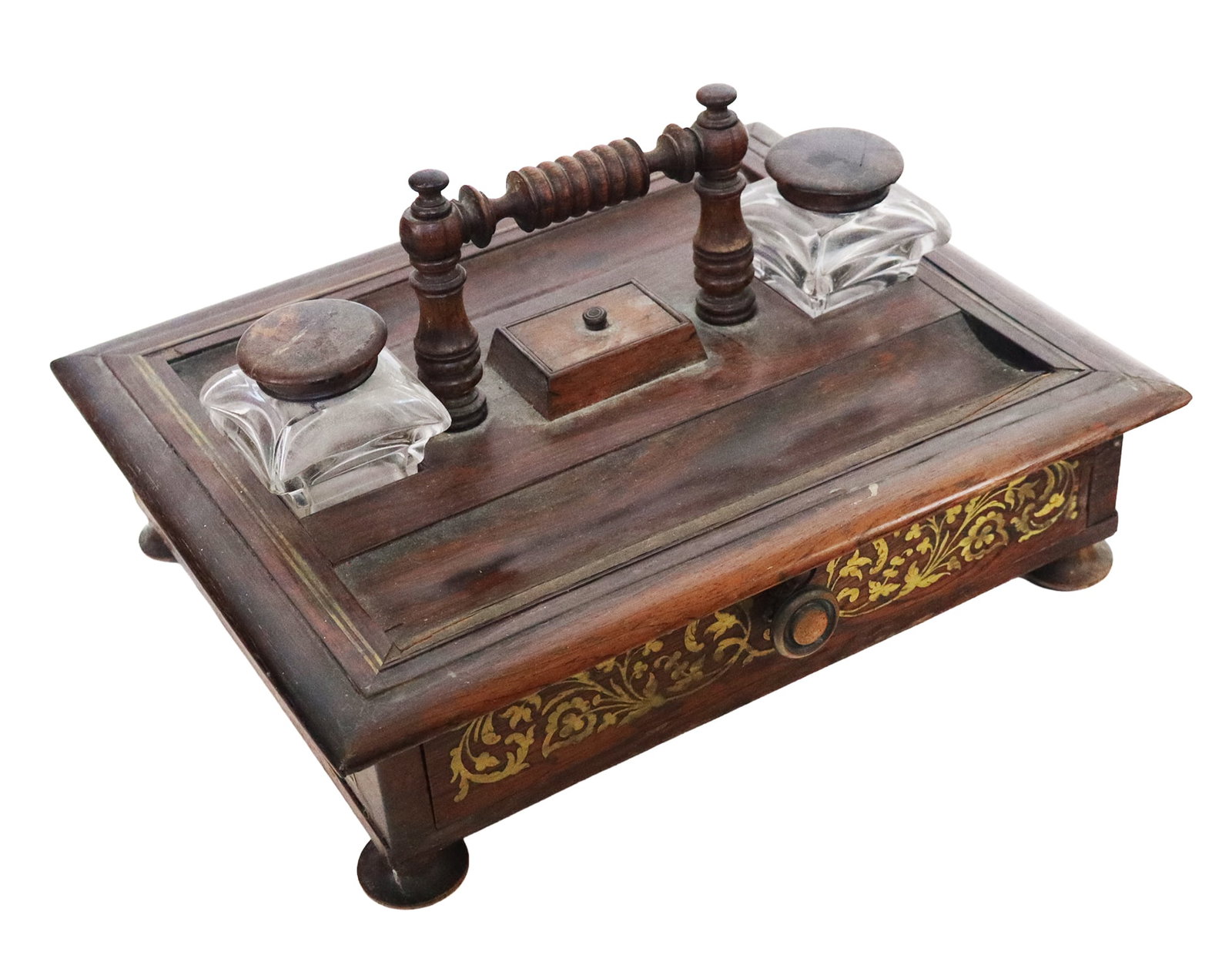 Victorian Rosewood & Brass Mounted Inkstand: Victorian rosewood inkwell / desk set, 19th-20th century, having inlaid brass foliate designs and a single compartment. [7.5" H x 12.25" W x 10" D]. As-is condition, splits and other damages, residue