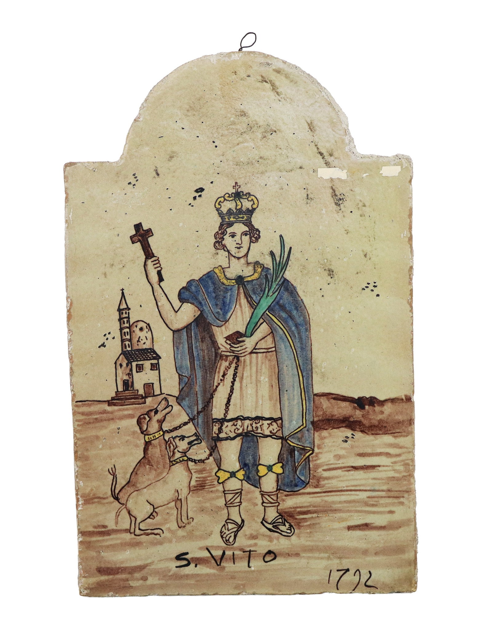 Italian Majolica Plaque with Saint Vitus: Italian majolica plaque, 18th century, depicting Saint Vitus before a church with dogs, marked S. Vito to lower, with date 1792. [15.75" H x 10" W]. Condition is good with minor wear to edge.