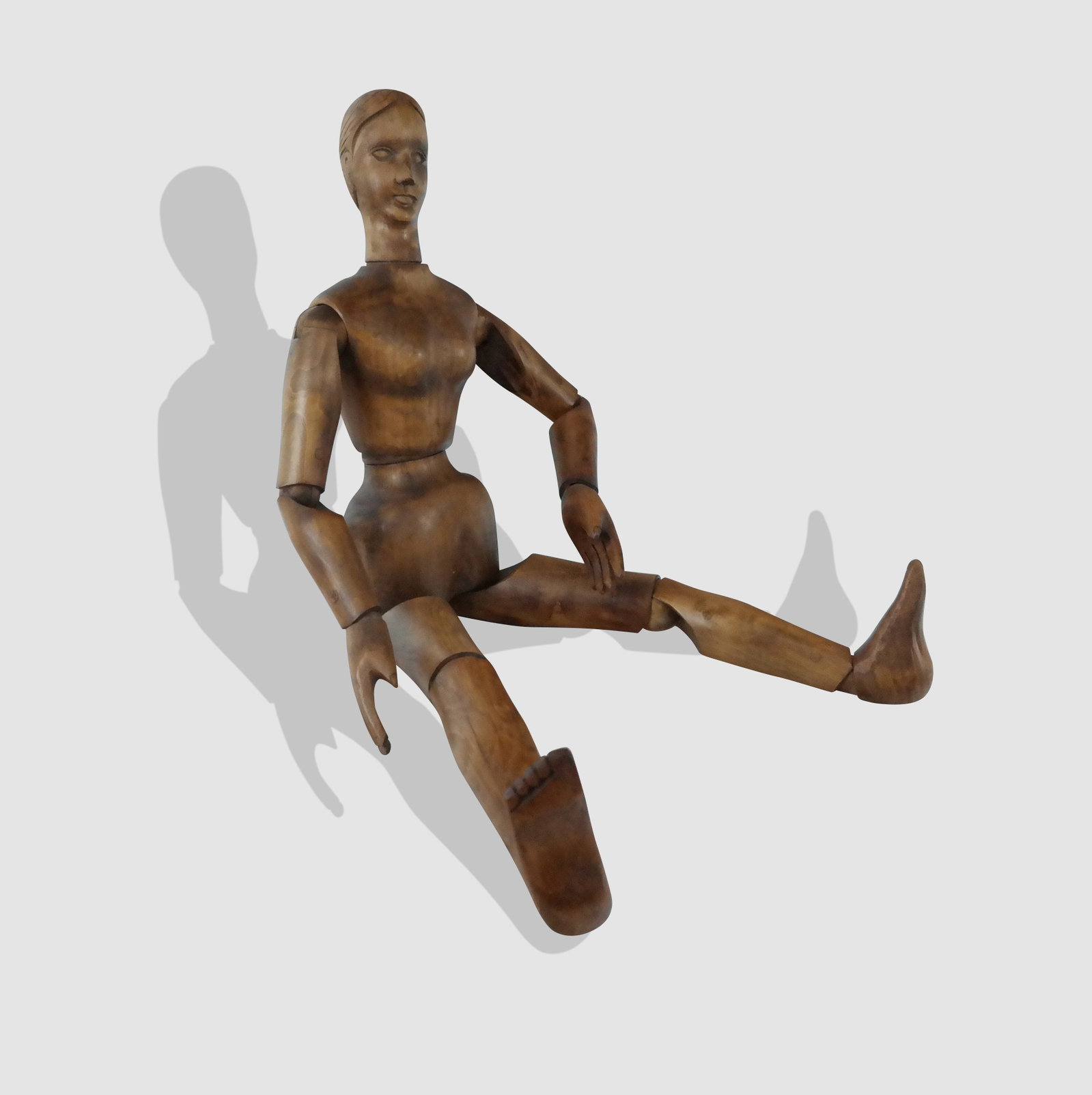 French Articulated Artists Mannequin: French articulated artist's mannequin, France, mid 20th century, with moving shoulders, elbows, wrists, hips, knees, ankles, torso and turning neck, wood dowels, No markings. [32" long]. Very good con