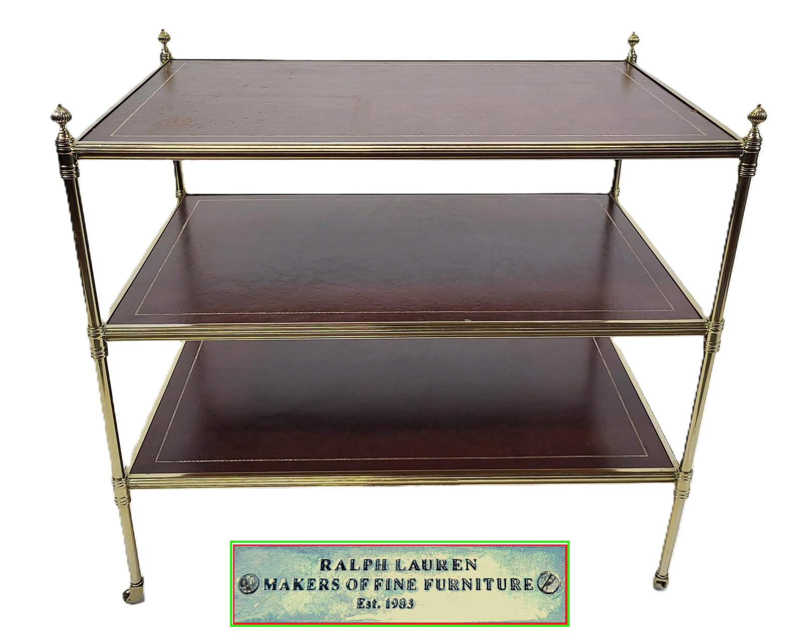Regency Three Tier Large Stand: Regency three tier large stand, mid to late 20th century, with tooled leather tops on brass frame having reeded ball finials, on casters. [29.5" H x 32" W x 21" D]. Good condition, wear to leather top