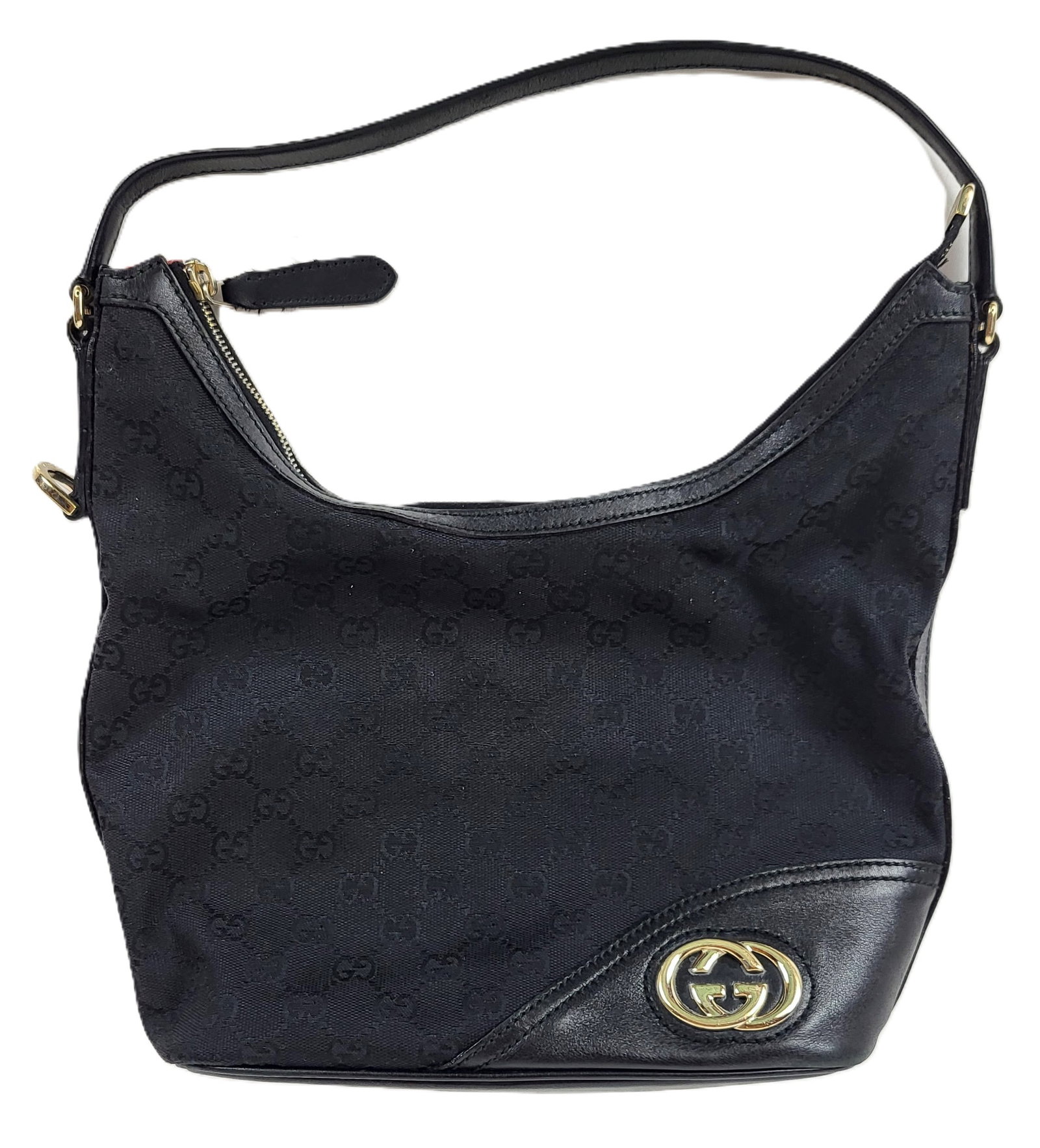 Gucci Monogrammed Canvas Shoulder Bag: Gucci monogrammed canvas shoulder bag, early 21st century, with leather accents and gold tone double G to outer, marked Gucci to hardware, to interior label, and with serial and model numbered to reve