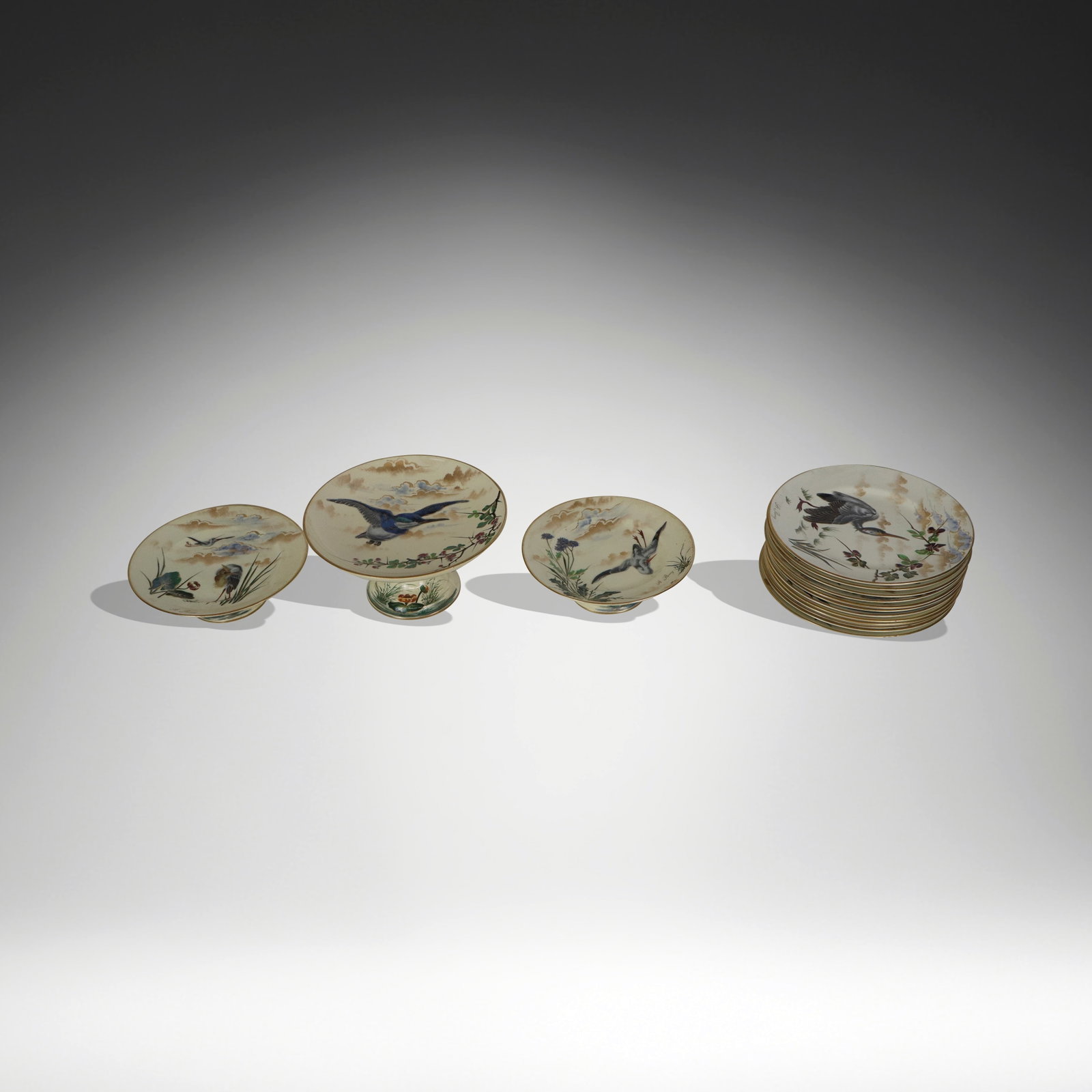 Keller & Guerin Grandes Oiseaux Dessert Set, 15: Keller & Guerin "Grandes Oiseaux" hand-painted dessert service, French, 20th century, each with raised decoration depicting a bird in flight with nature as a backdrop, comprising twelve dessert plates