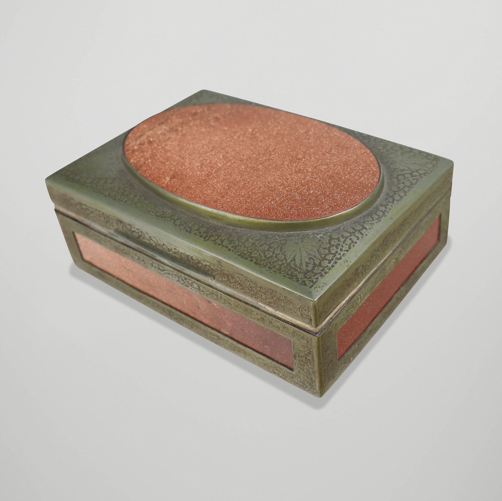 East Asian gold stone and hammered metal box, late 20th century. [2" H x 6.25" L x 4.5" D]. Overall: East Asian gold stone and hammered metal box, late 20th century. [2" H x 6.25" L x 4.5" D]. Overall condition is good, with oxidation to metal and minor scratches to gold stone.