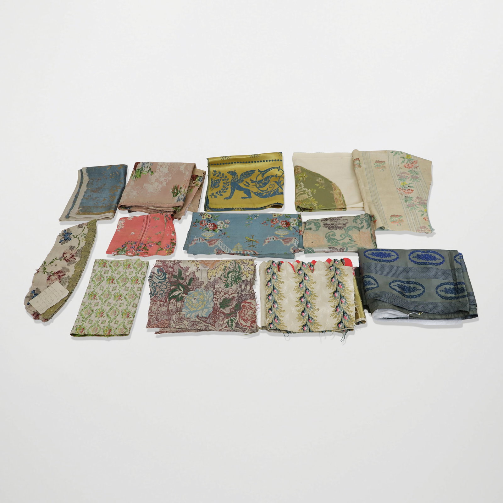 French and Italian Silk Brocade Fabrics and Fragments: Fabrics and fragments; 18th and 19th century, some very finely brocade, silk floral patterns and more. Frayed, tattered, worn and aged.
