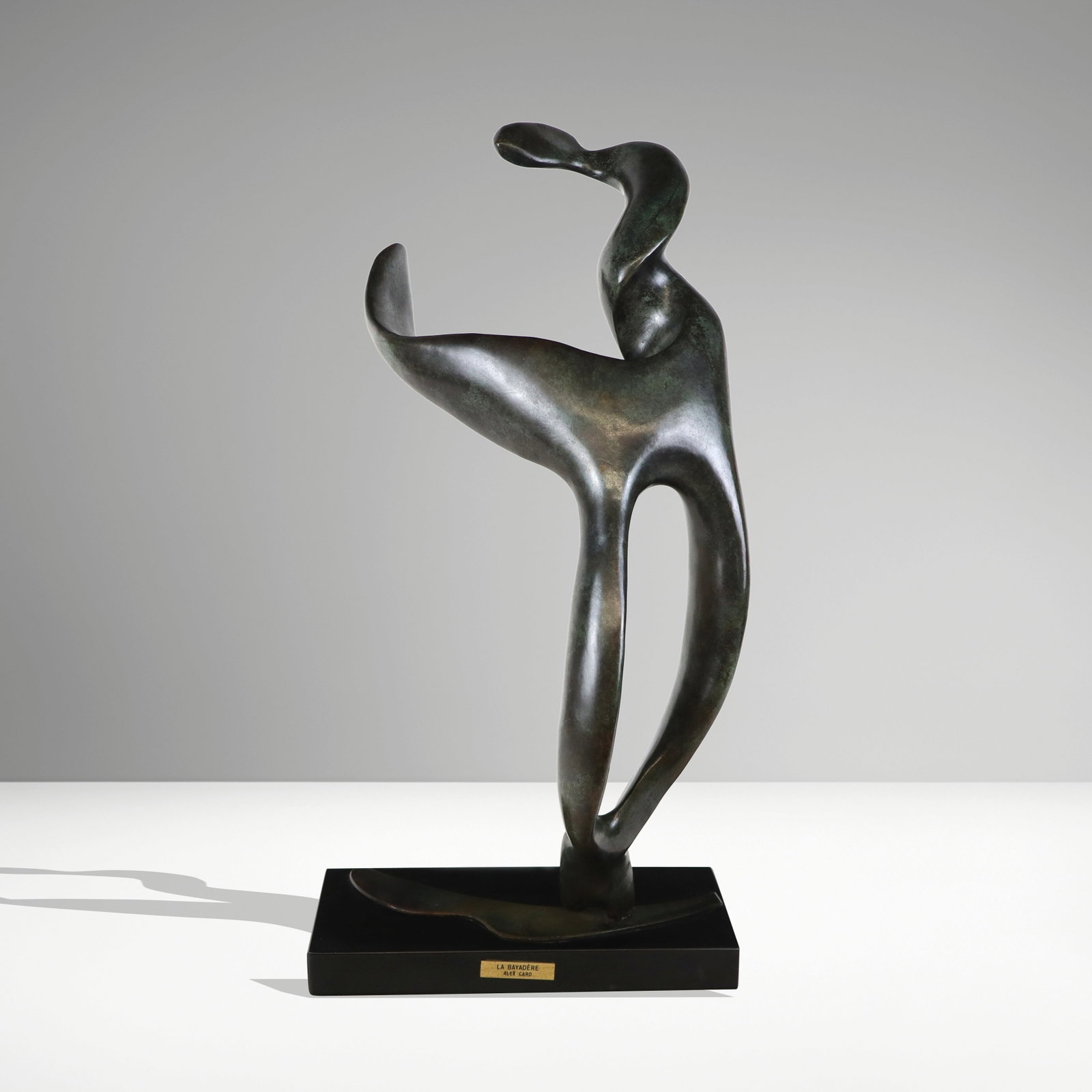 Alexandra "Alex" CARO "La Bayadere" Bronze: Alexandra "Alex" Caro (Egyptian/Canadian 1930-2012). "La Bayadere" Bronze abstract figural sculpture in a fine patina bronze, mounted on a marble base. Signed lower part of loop, edition 7/8. [Bronze 