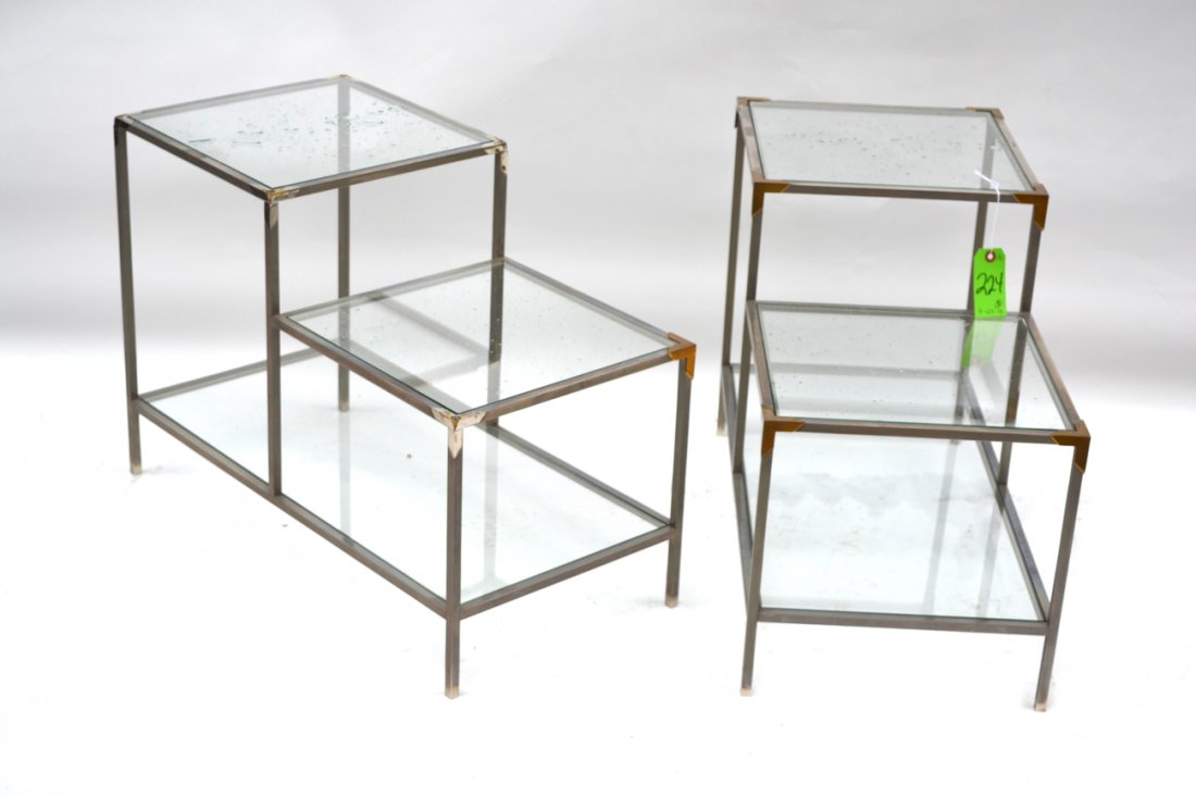 Maison Bagues Pair of End Tables: Pair of mid century Maison Bagues two-tier step tables, c. 1970. One glass damaged, five brass corner accents missing. [19 1/2" H x 27 1/2" W x 14" D].