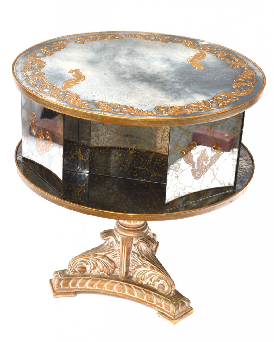 Grossfield House Book Table: Revolving decorated mirrored book table, possibly from Grossfield House. [28" Dia x 29 1/2" H]. Panel damaged.