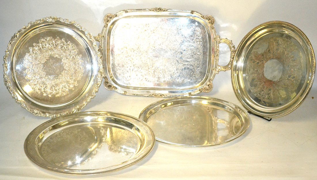 5 Silver Plated Trays: Five silver plated trays.