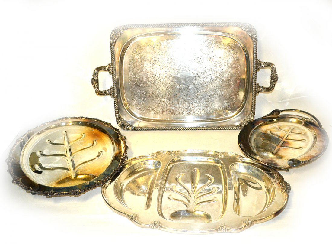 4 Silver Plated Trays: Four silver plated trays.