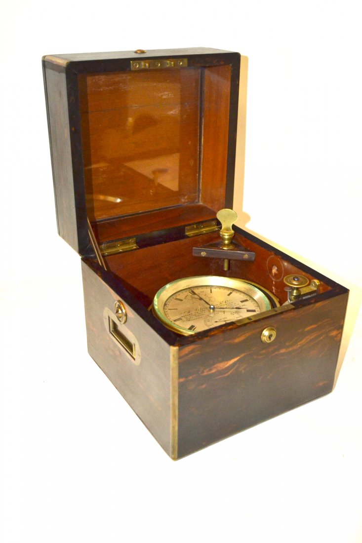 Ships Compass in a Rosewood Case: A. Johannsen & Co. London, face loose - possibly missing parts. [9" x 9" x 9 1/4" H].