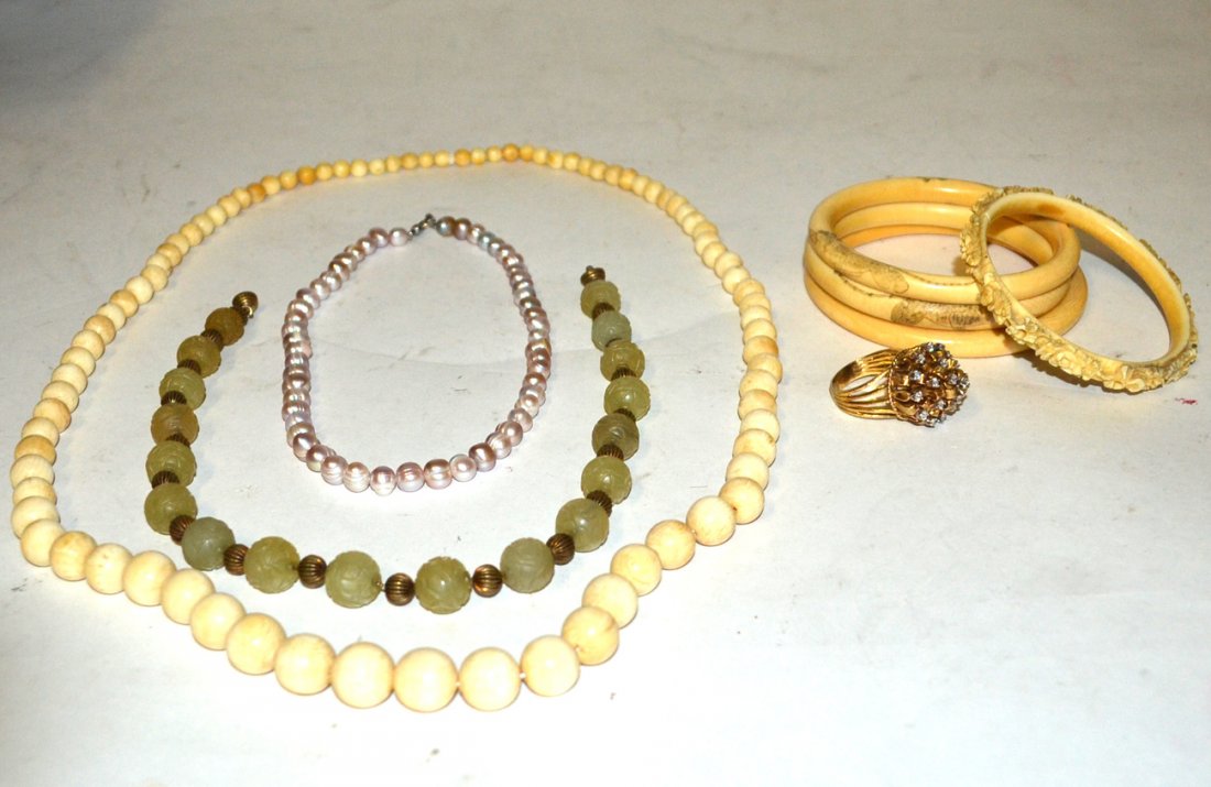 Vintage Ivory, Jade. and Costume Jewelry: Comprises: 1). Four carved ivory bangles (one cracked). 2). Necklaces comprised of 80+ graduated ivory balls. 3). Freshwater pearl choker [15 1/2" long]. 4). Carved jade ball choker [16" long]. 5). Go